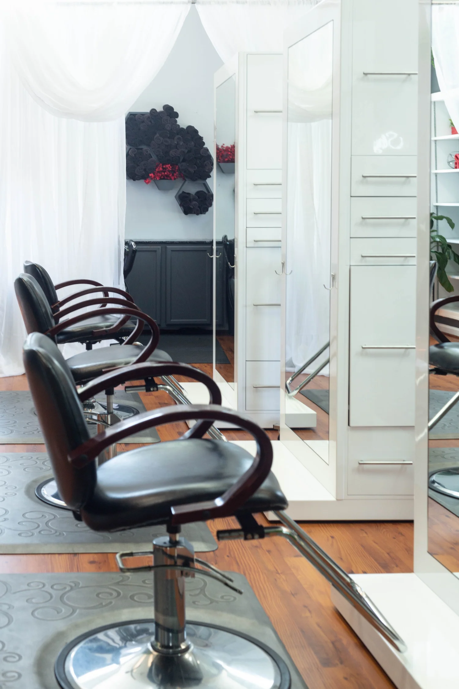 Styling stations and mirrors inside Vanquish Beauty Studio