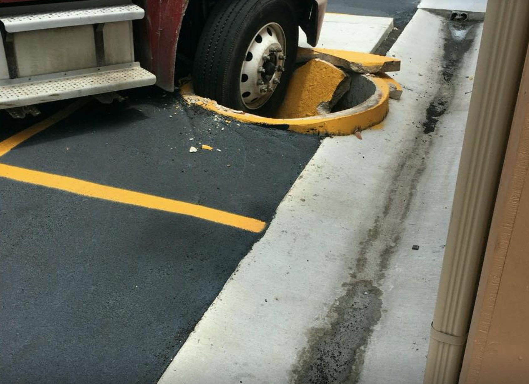 Truck Damage Outside Lot of Business Building