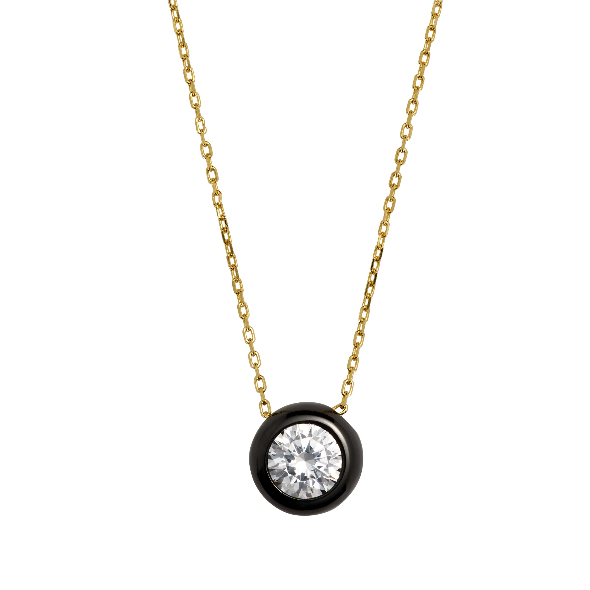 Gold chain necklace with a round black bezel setting containing a large clear crystal gemstone.