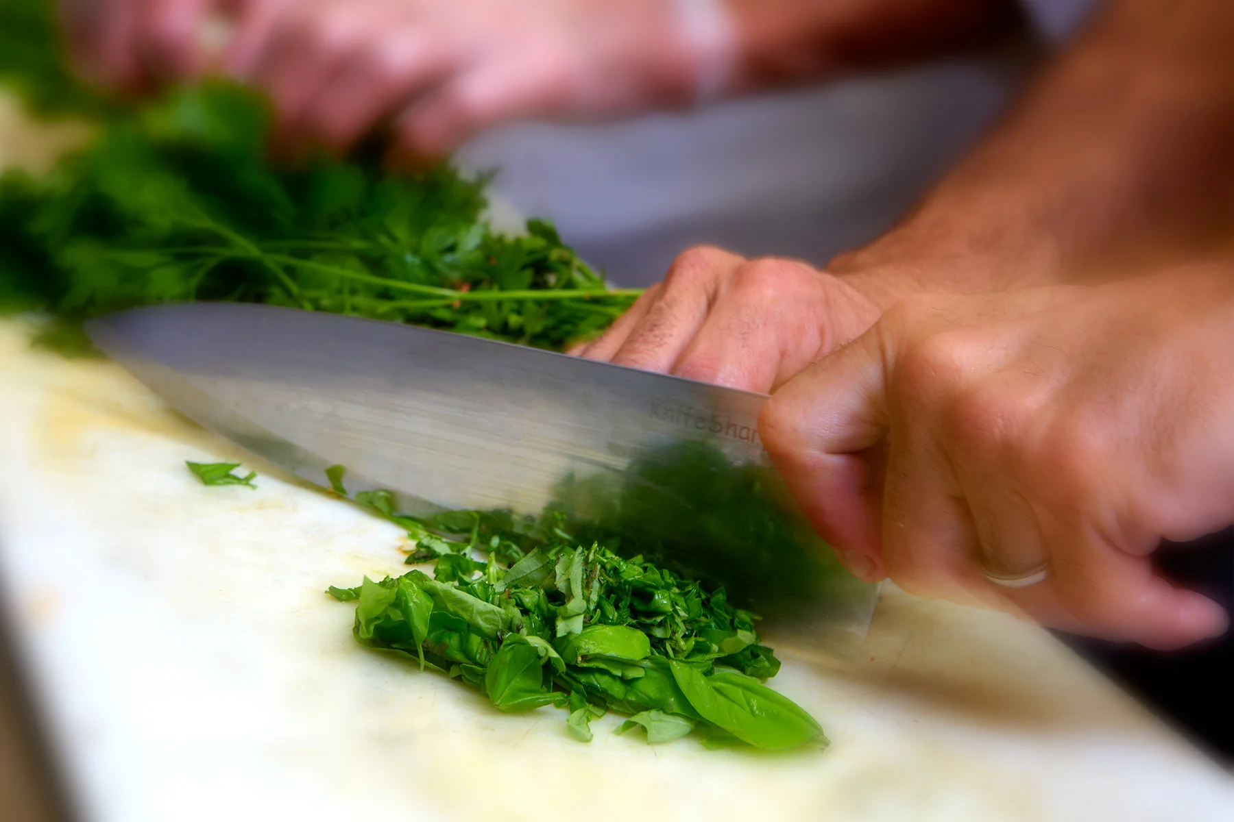 hands, cutting, knife, entrée, dinner, food, Long Island restaurant photographer, Long Island food photographer, product photographer, photographer, studio photographer, packaging, John Montana