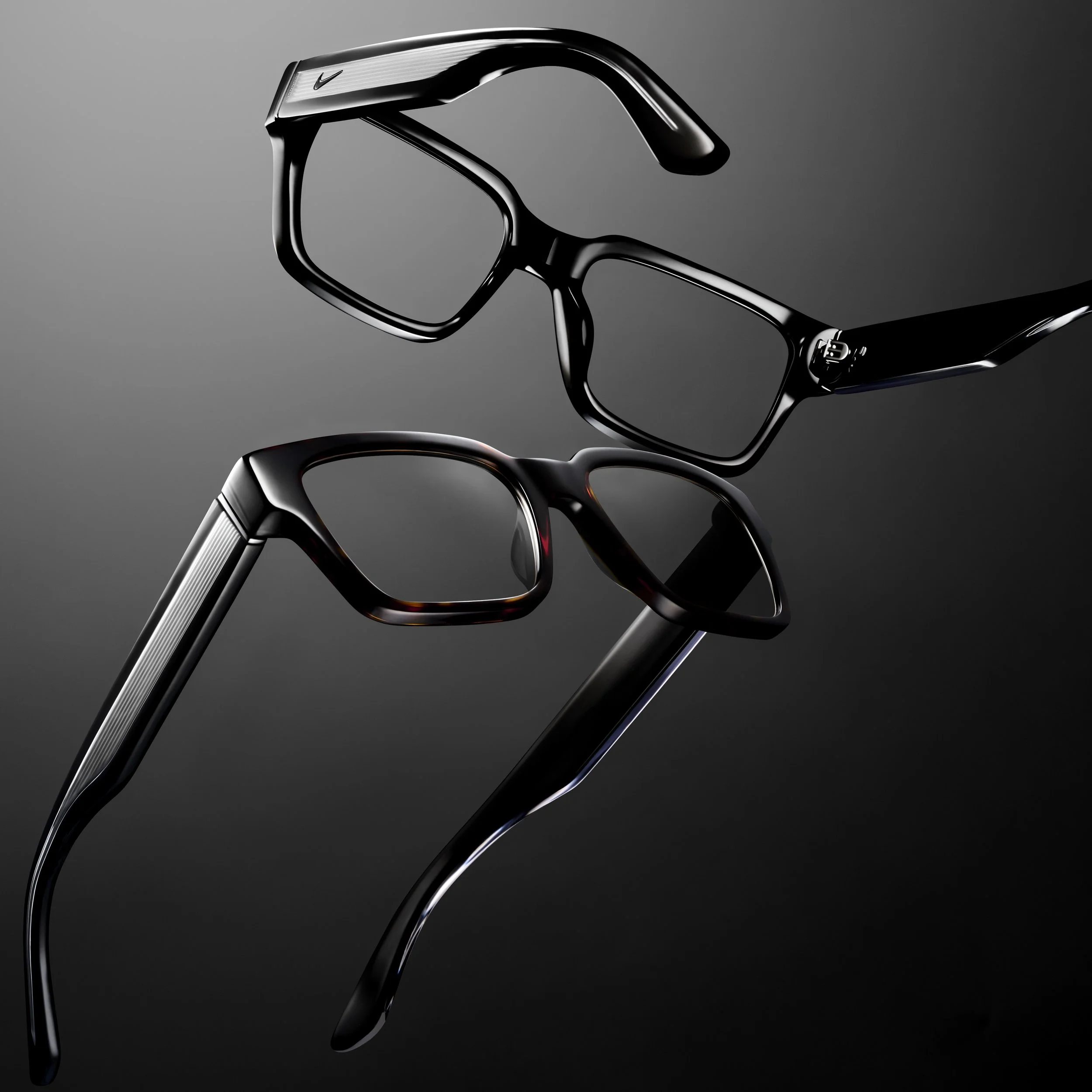 Close-up photo of black eyeglasses with a sleek, modern design against a dark background.