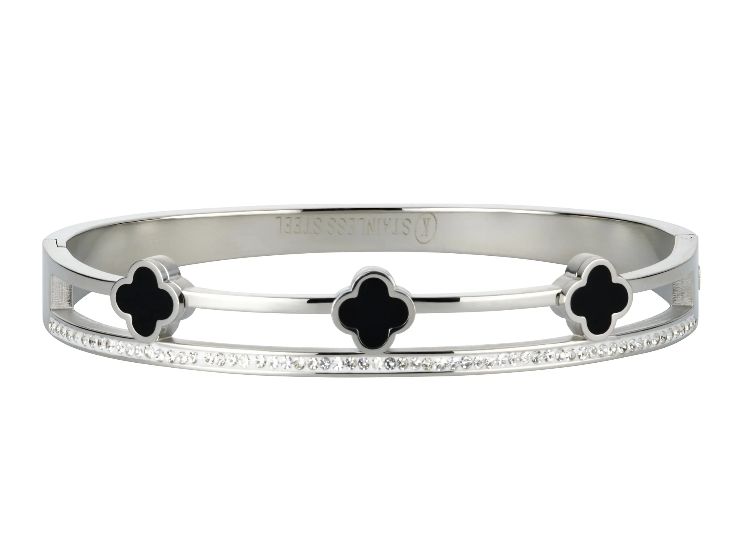 A silver bracelet with three four-leaf clover-shaped black accents and a row of small diamonds along the band.