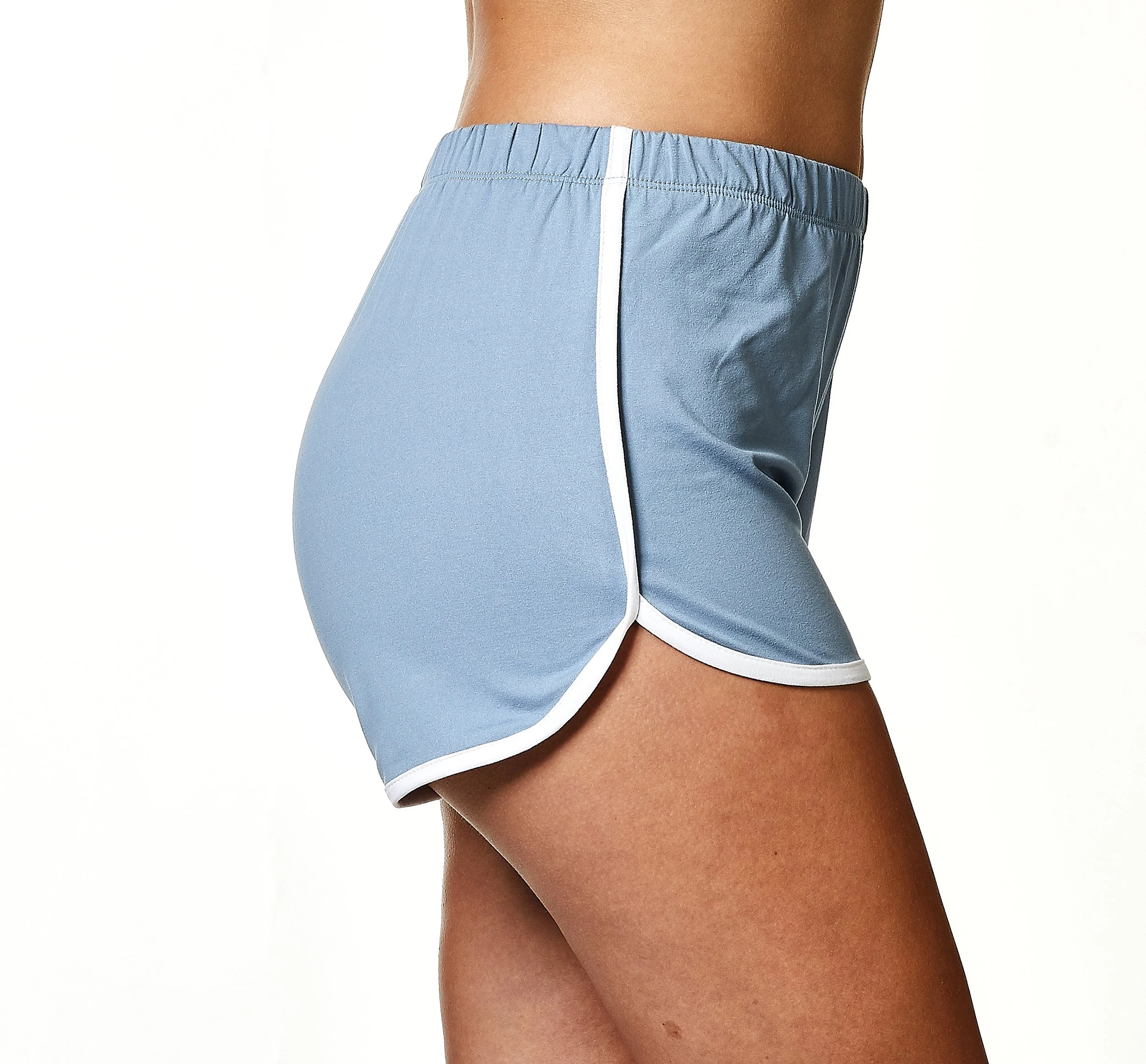 Close-up of a woman's lower torso wearing light blue shorts with white trim.