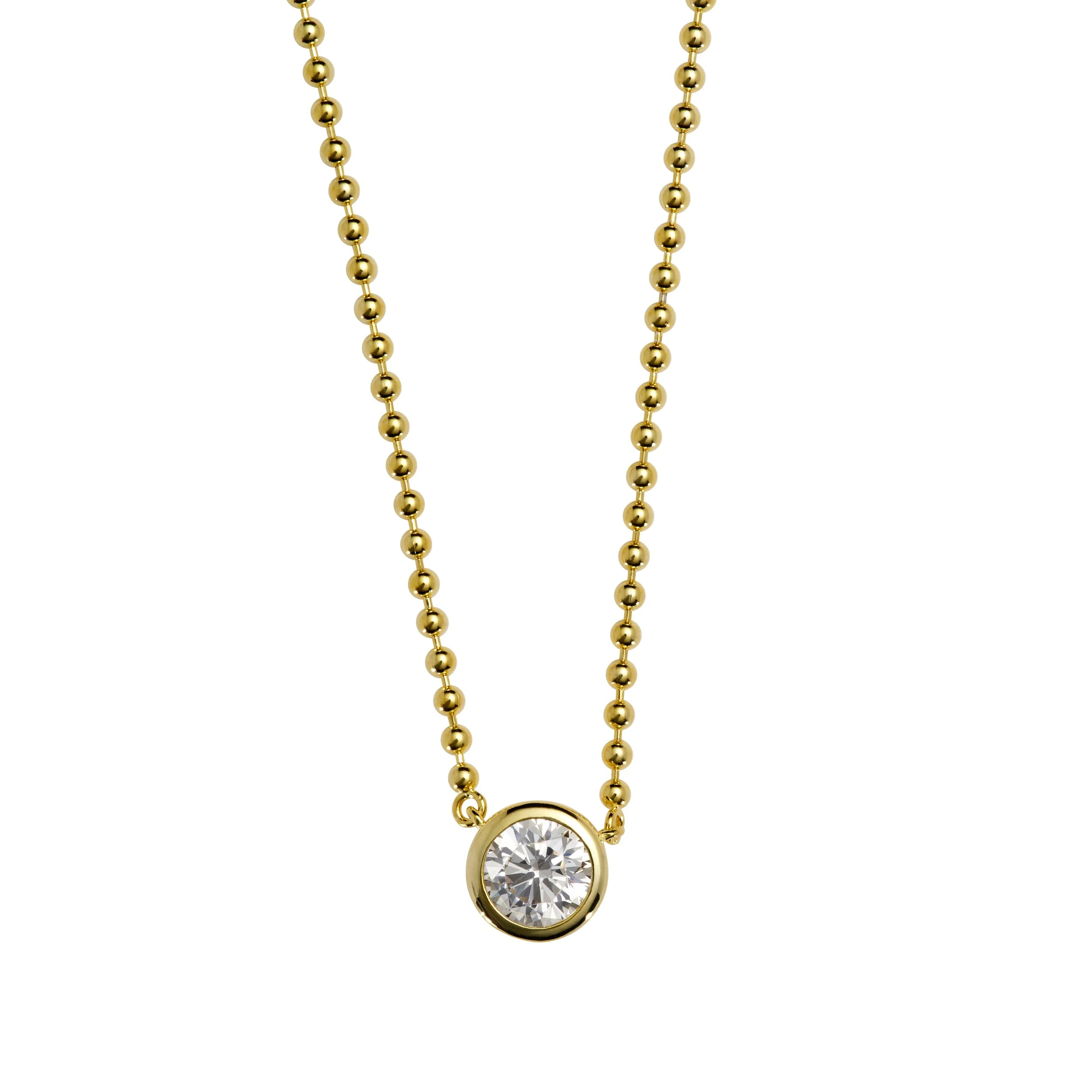 Gold chain necklace with a bezel-set round diamond pendant.