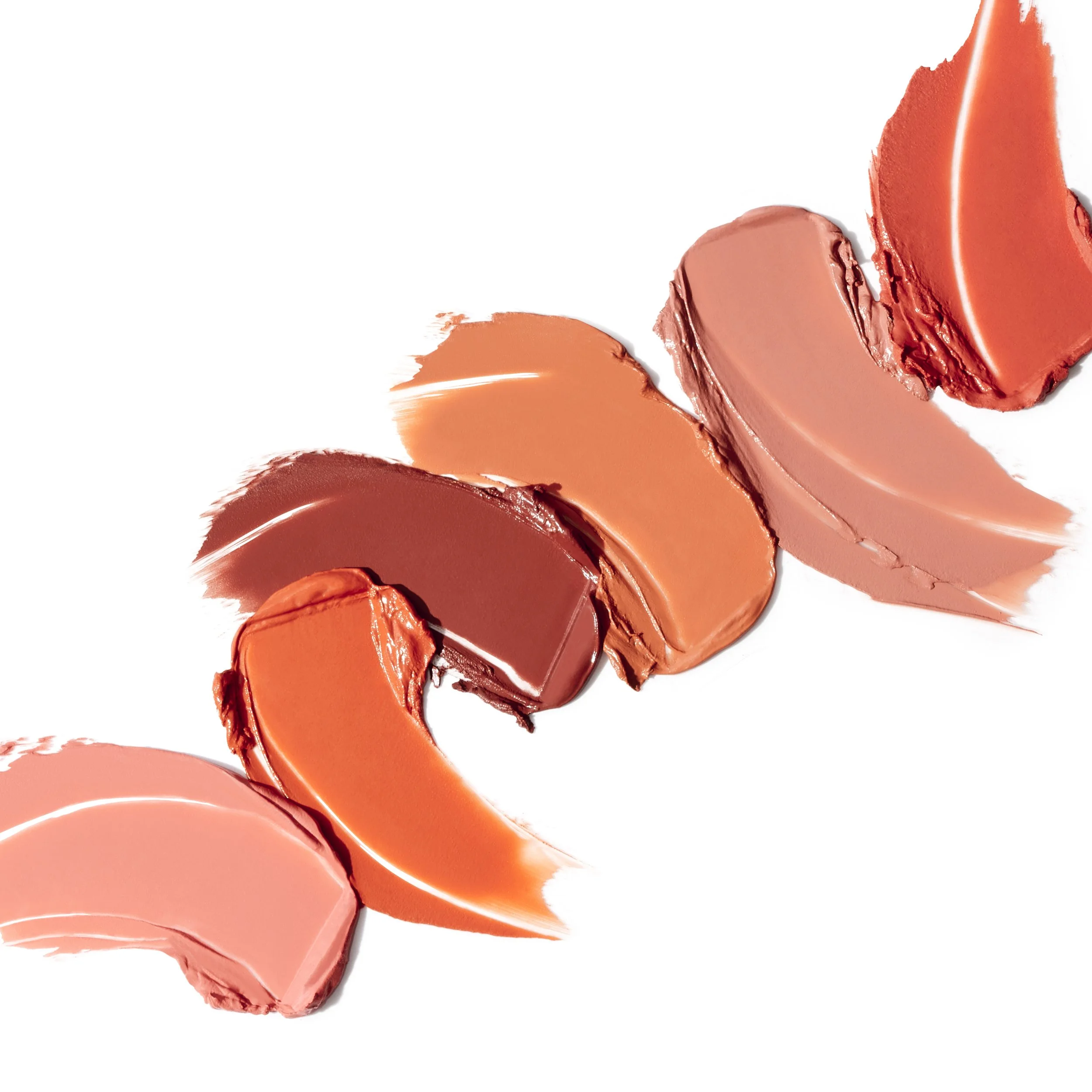 Swatches of various shades of lipstick on a white background.