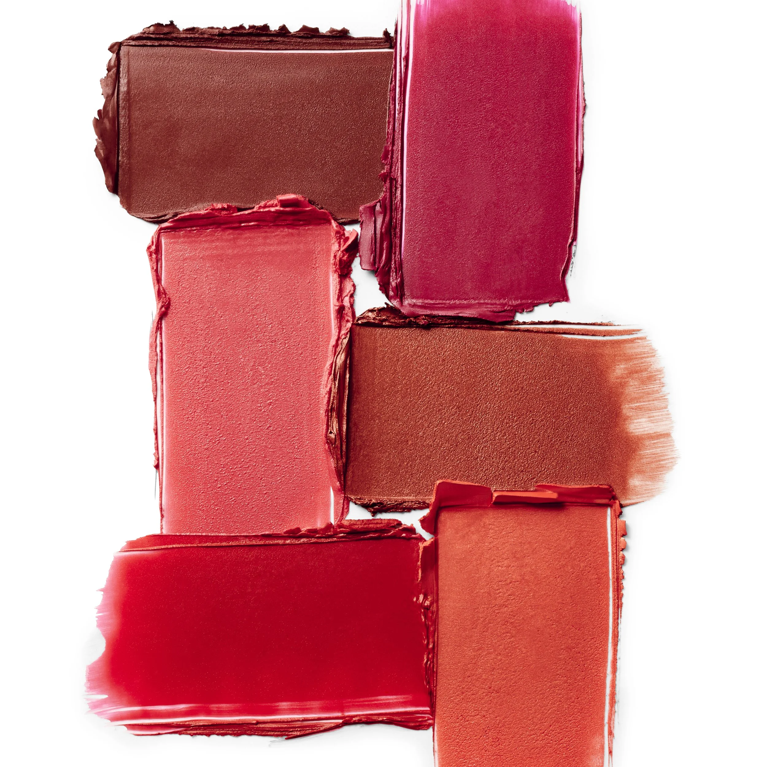 Collection of six different lipstick swatches in shades of red, pink, and brown on white background.