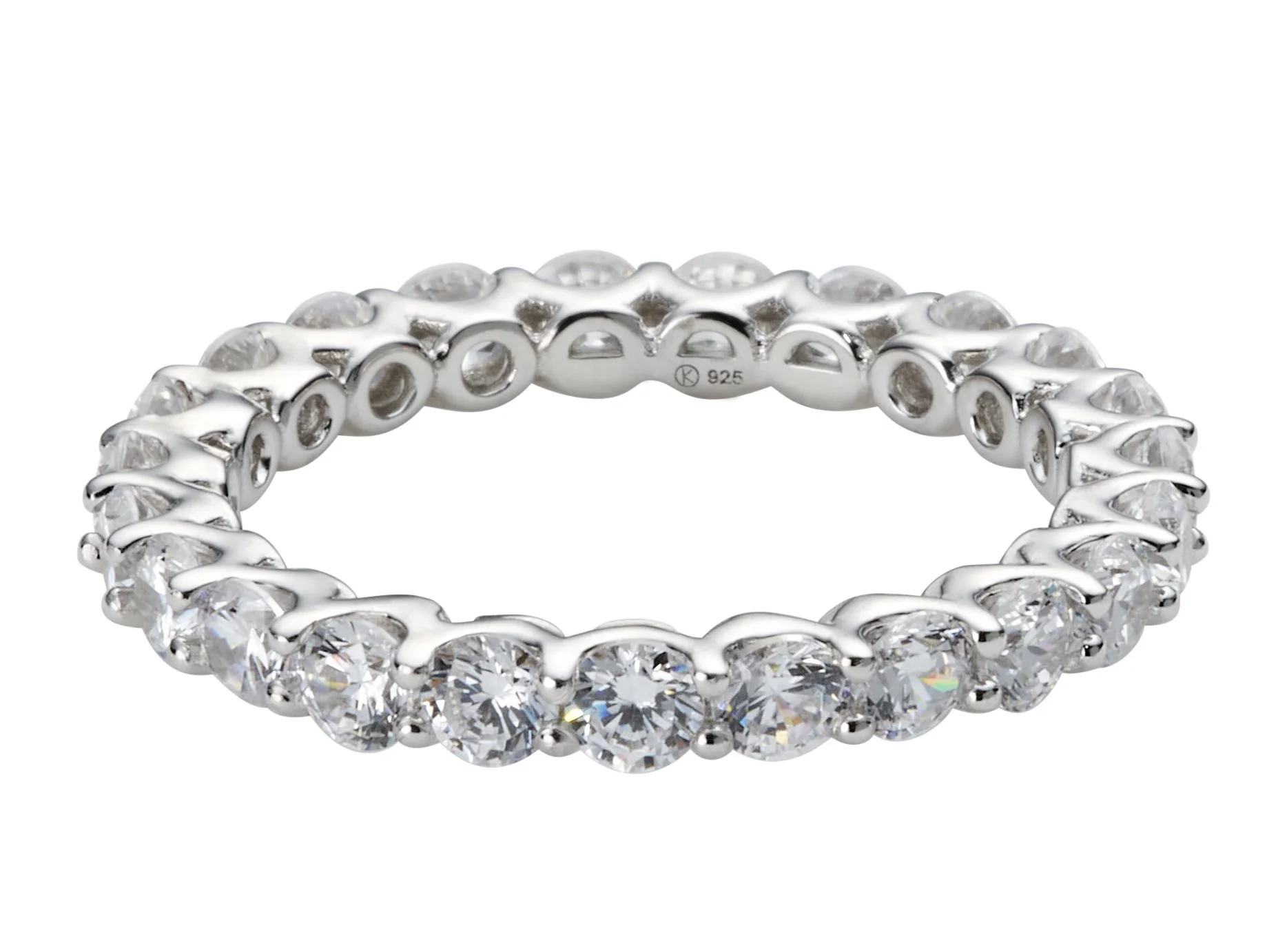 A silver ring with a series of large, clear, round-cut gemstones set all around.