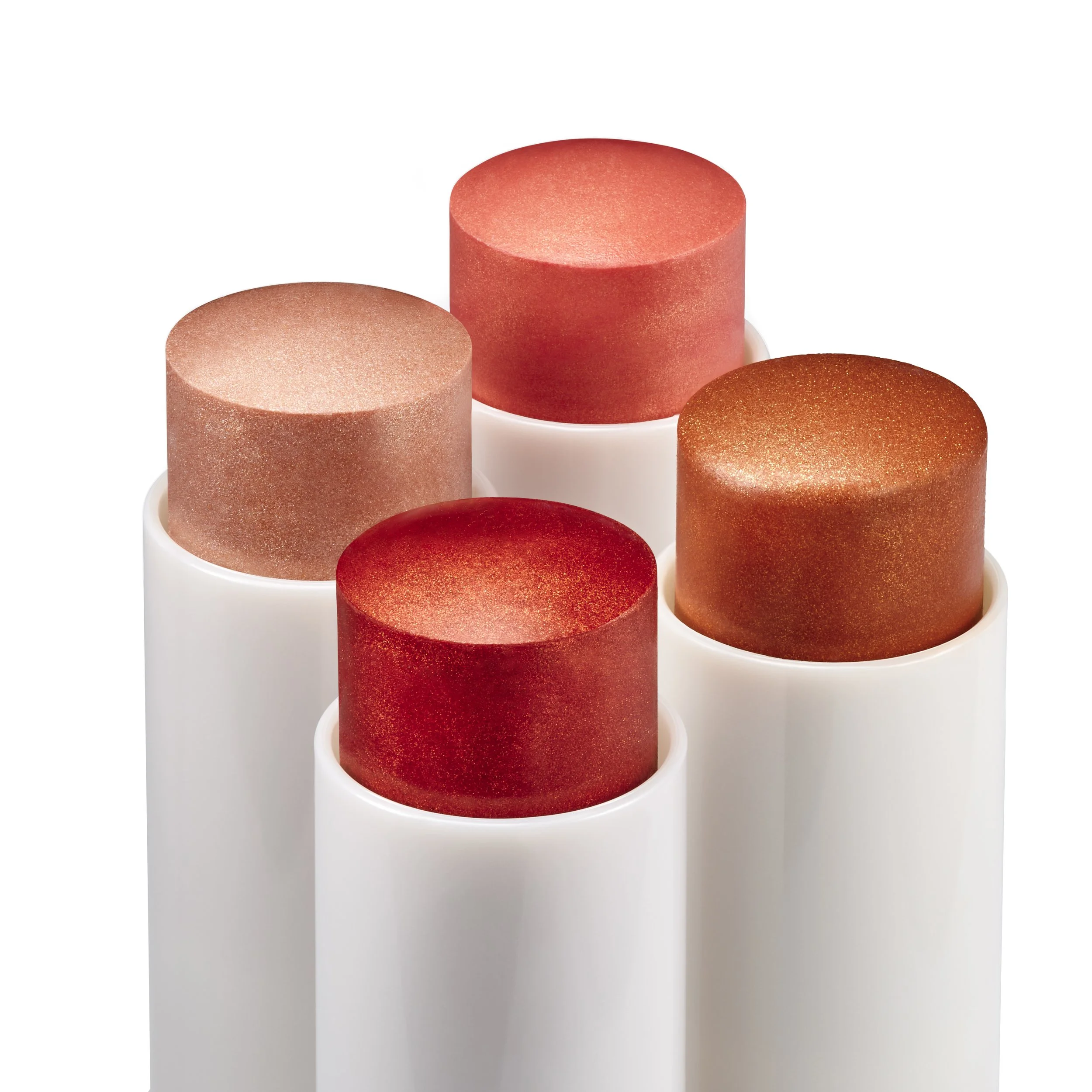 Five cylindrical lipstick tubes in shades of pink and red, with a shimmery finish, arranged in a cluster.