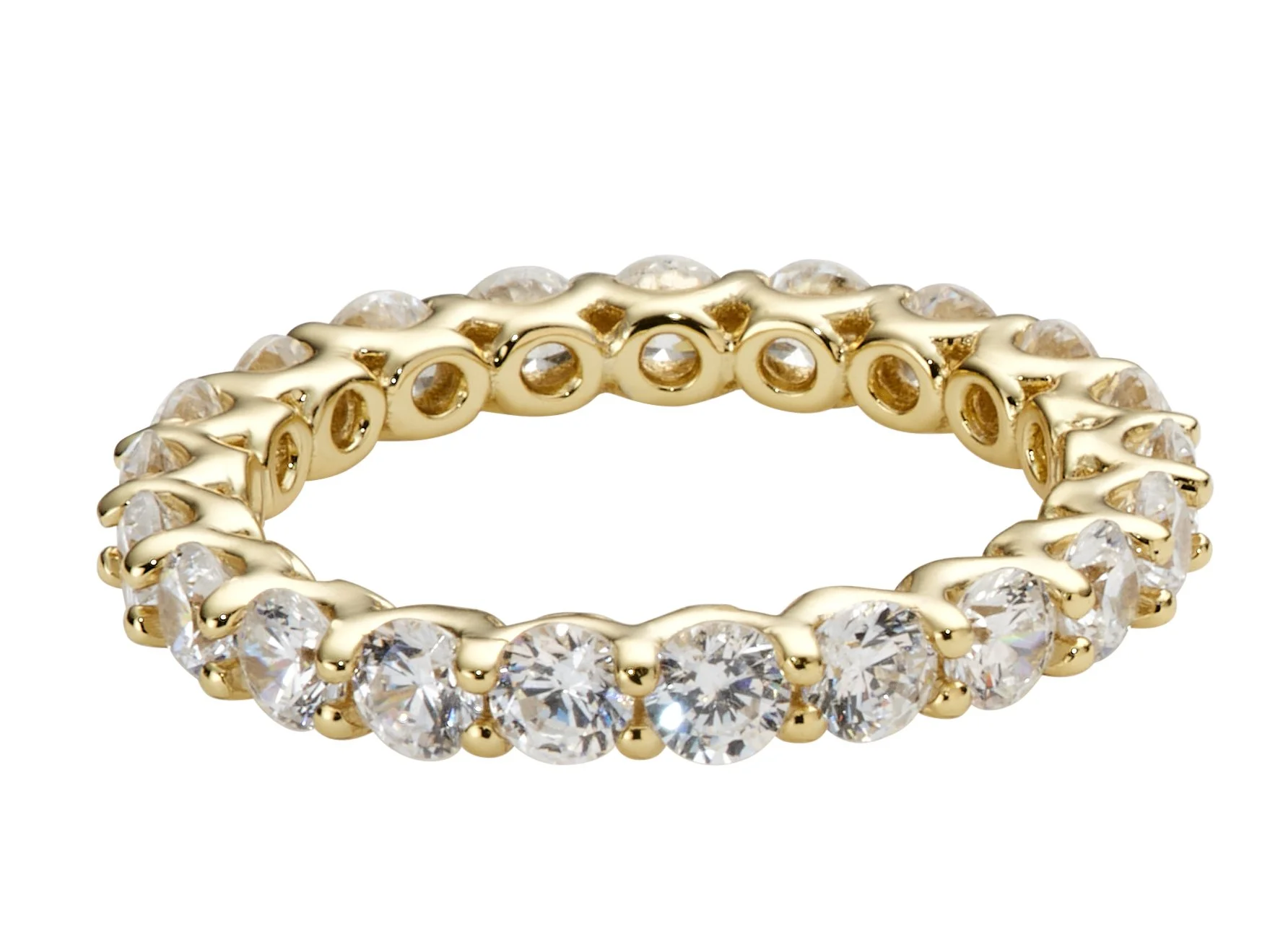 Gold ring with large clear gemstones all around