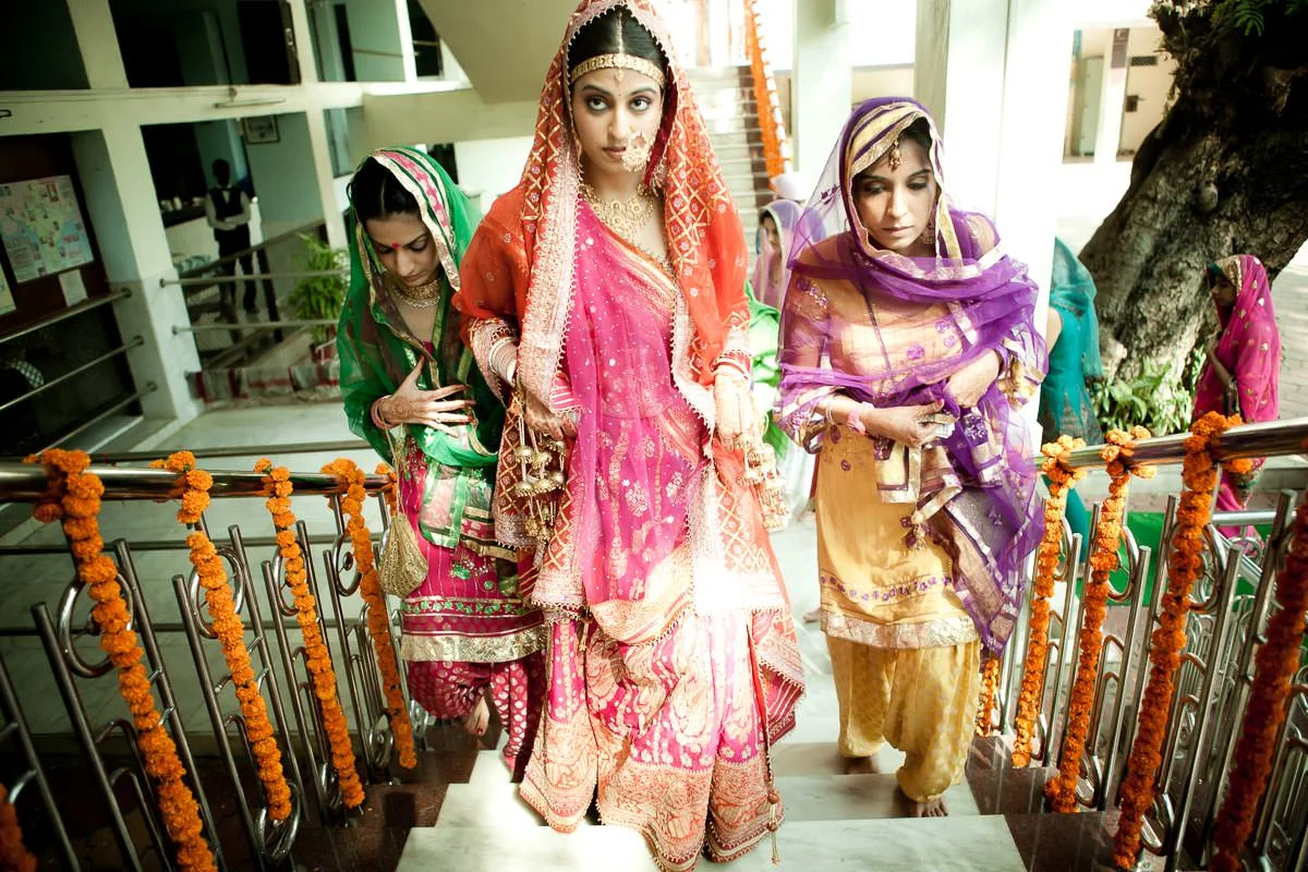 Sahiba with her sisters as she walks into the gurudwara.
