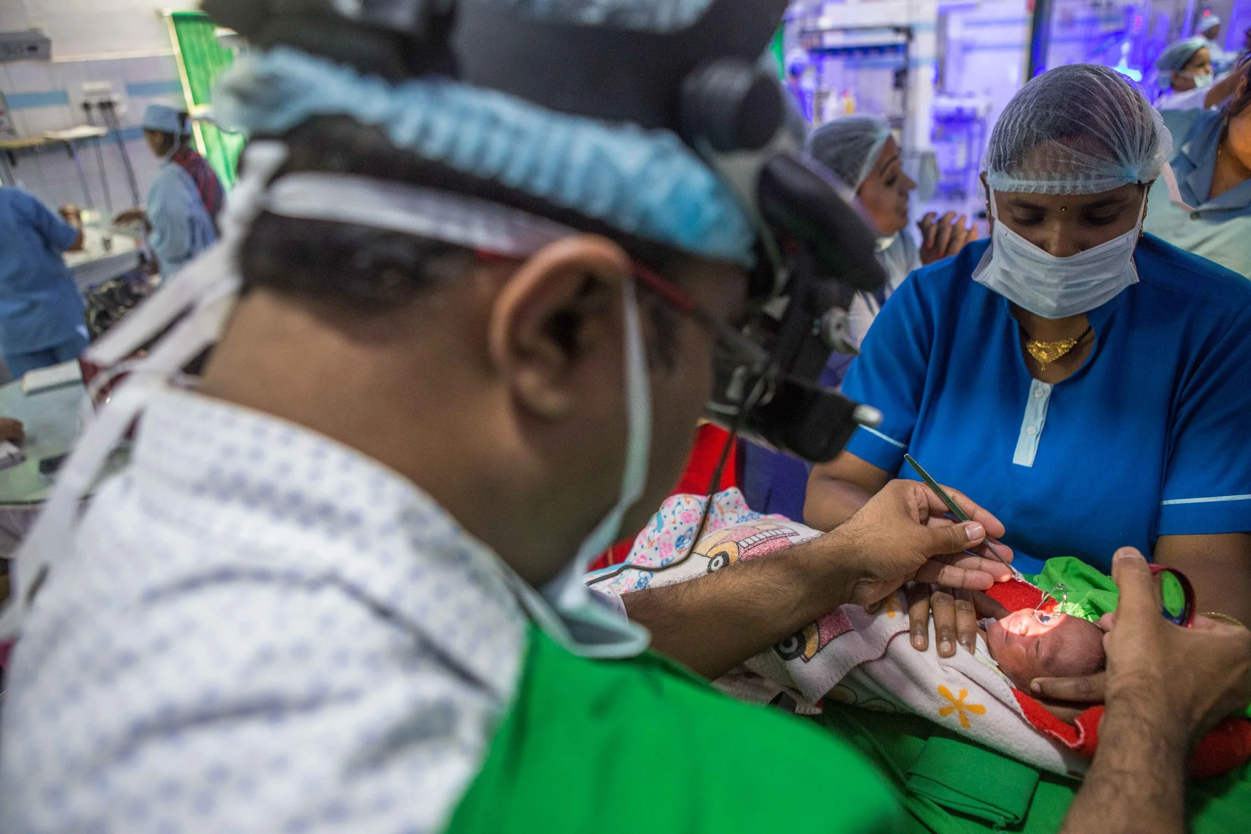 A doctor screens a baby for ROP. NICU Cuttack, Orissa