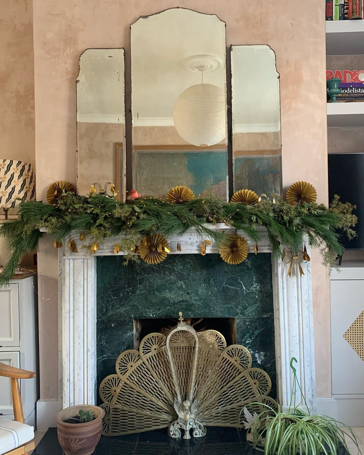 Beautiful Garland by @chloe_boulton on my mantle piece with @matildagoad brass bows and gold paper fans @cardfactoryplc