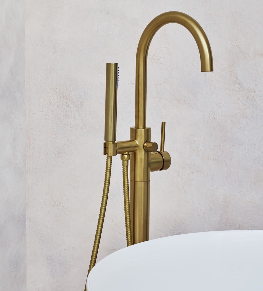 Floor standing bath taps in brushed brass.jpg