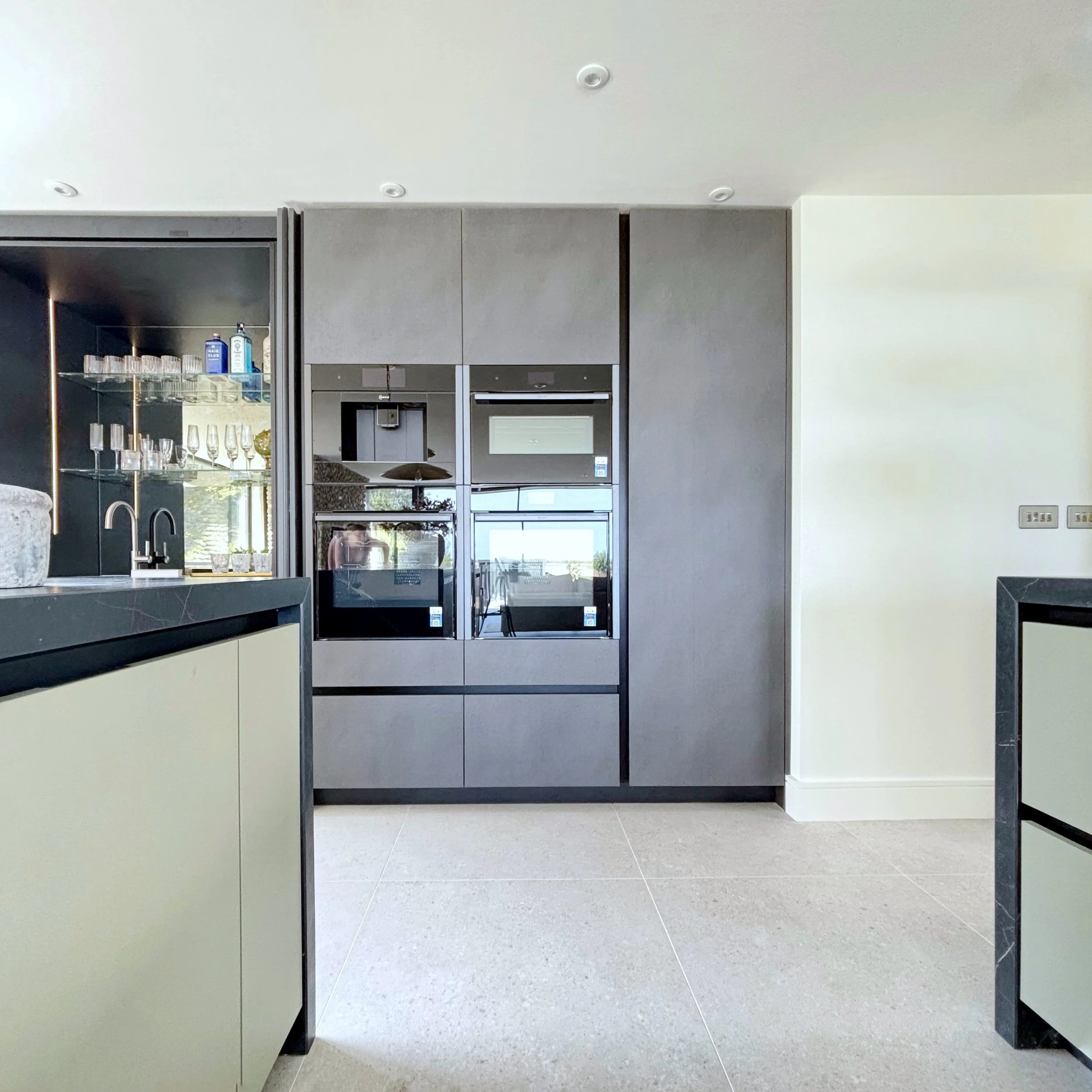 View of Neff ovens, microwave and integrated coffee machine