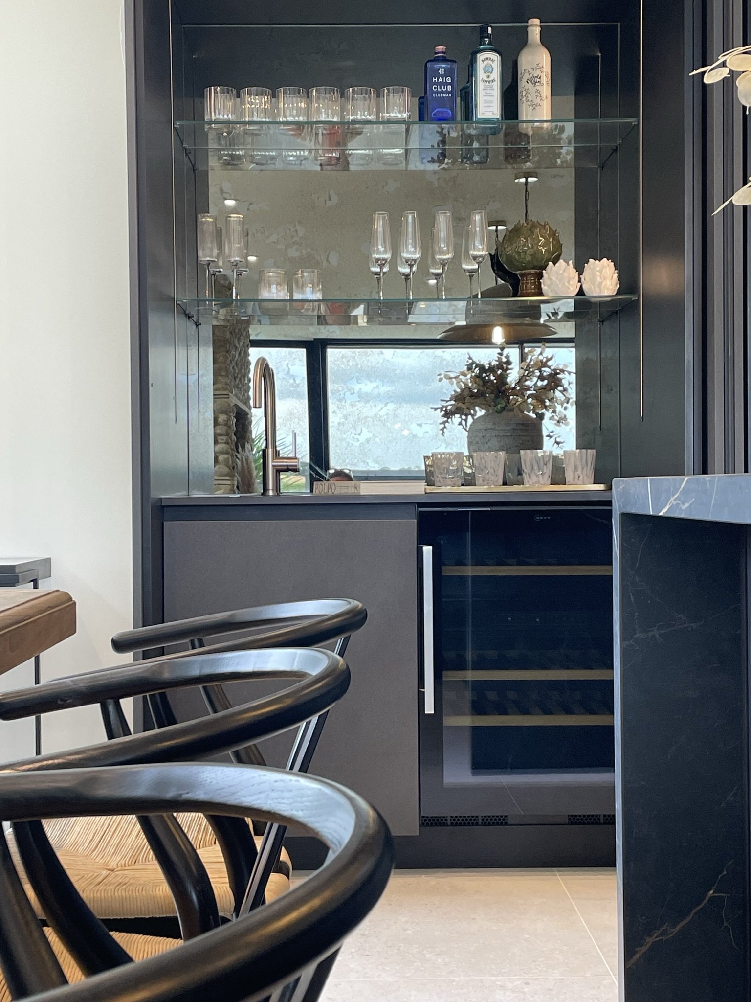 View of open pocket doors to show bespoke bar area