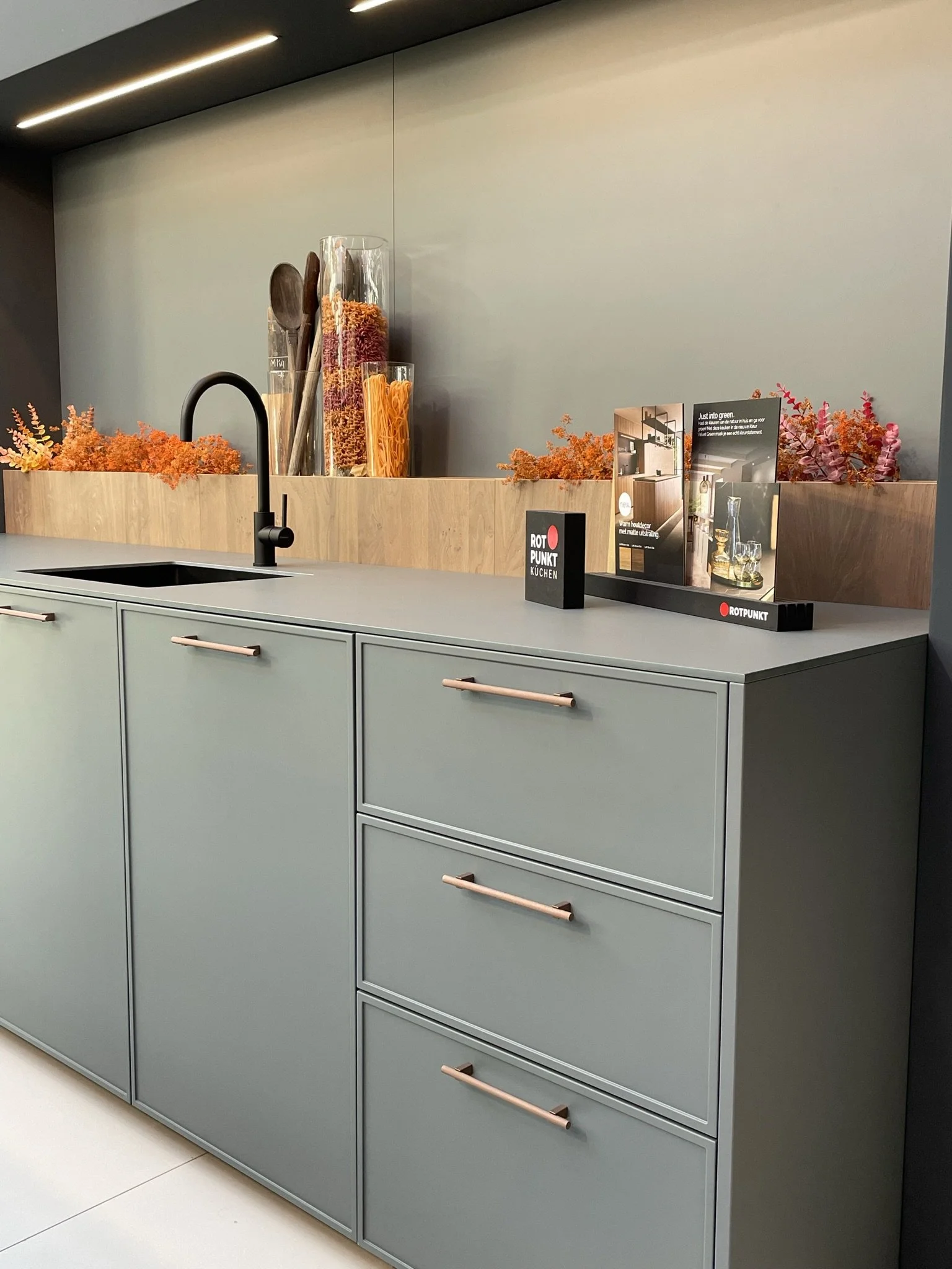 Green slim or micro shaker kitchen with knurled bronze handles