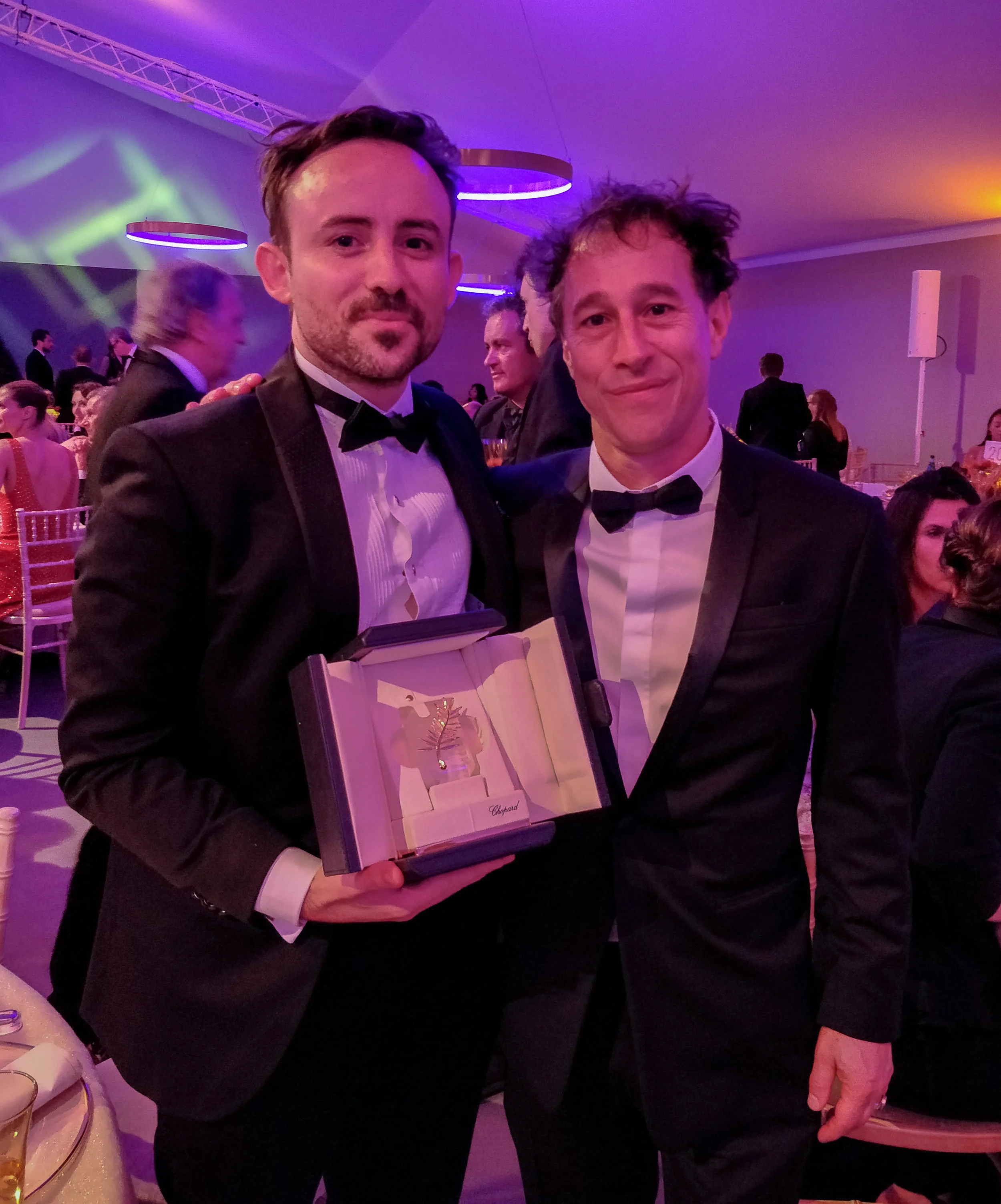 L-R Charles Williams holding his Palme d'Or Prize with President of the Cannes Short Film Jury, Bertrand Bonello - courtesy of the artist
