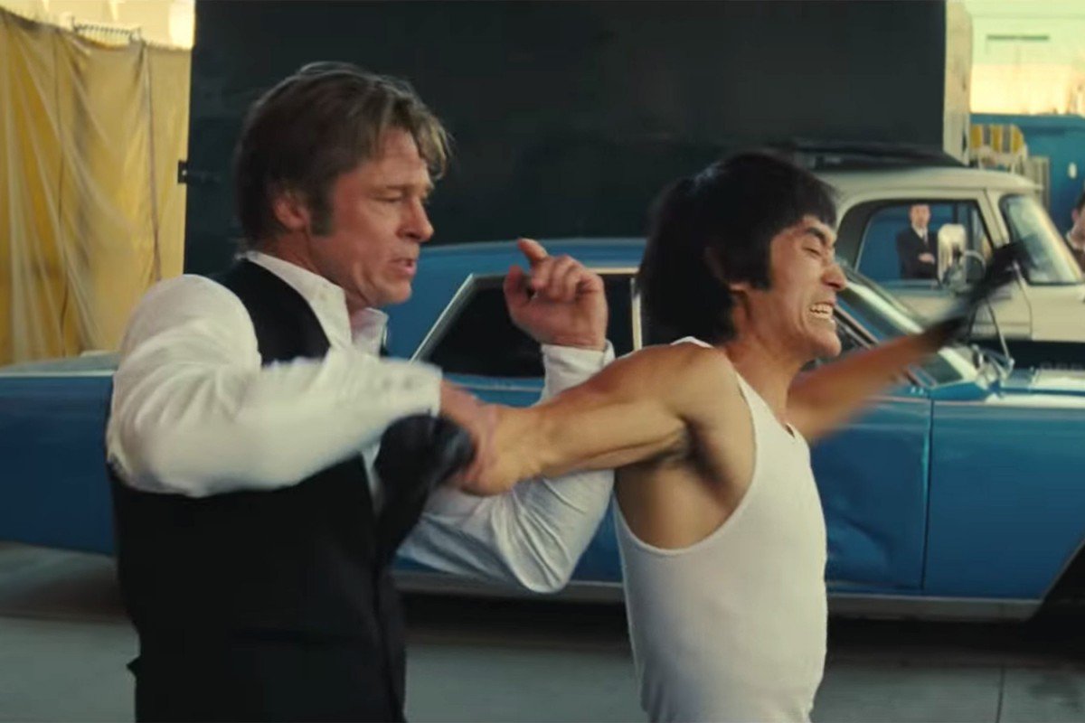 L-R Brad Pitt as Cliff Booth and Mike Moh as Bruce Lee in Once Upon A Time In Hollywood (2019)