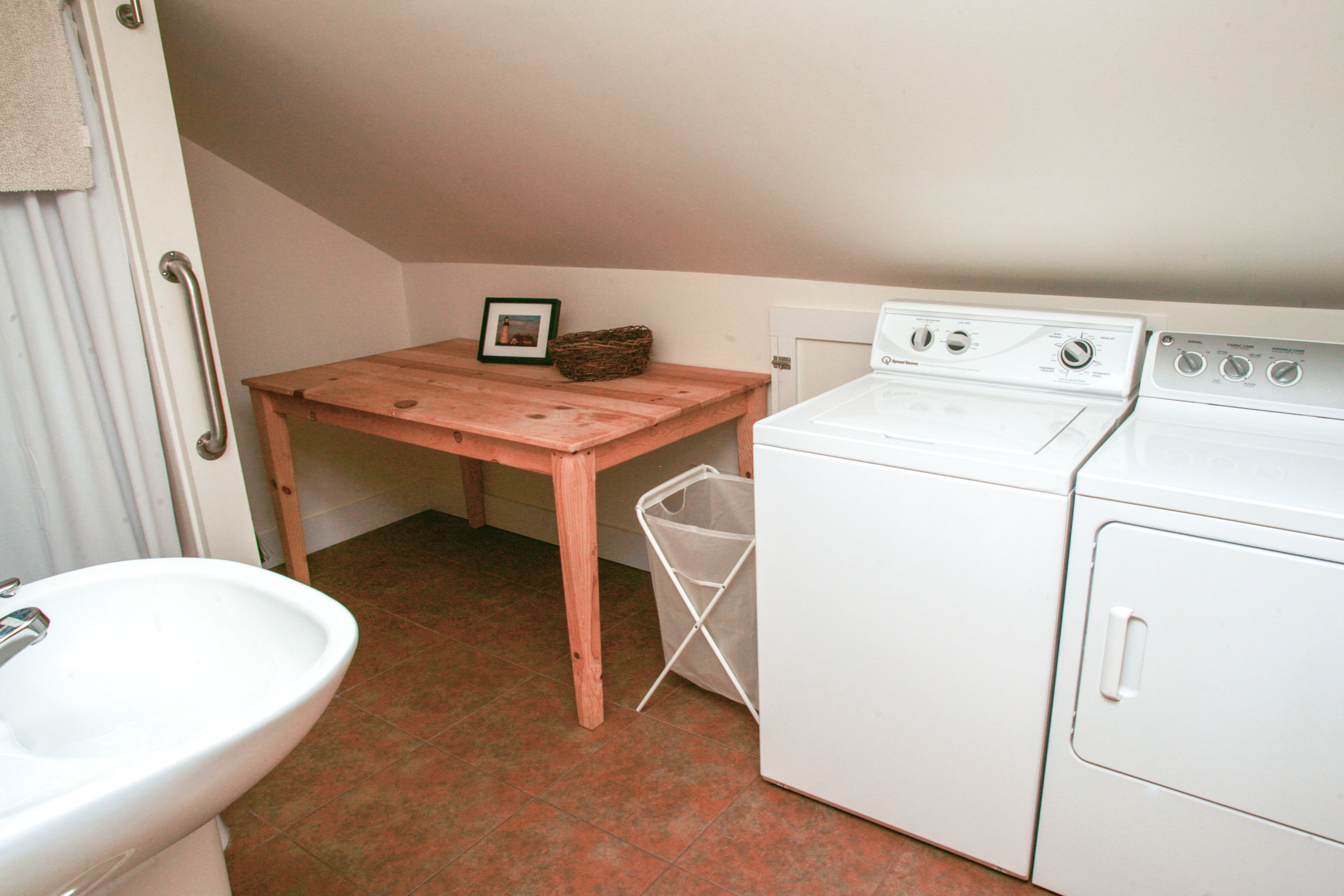 Bathroom has full capacity commercial washer and dryer for your use.