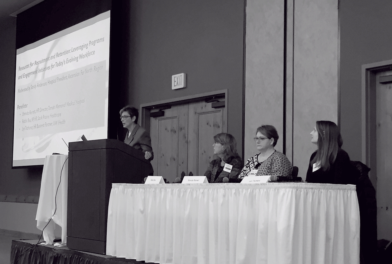 Sandy Anderson (Ascension North), addresses panelists Robbi Bos (Sauk Prairie Healthcare), Brenda Reinert (Tomah Memorial Medical), and Lyn Tschanz (UW Health), discussing provider retention initiatives.