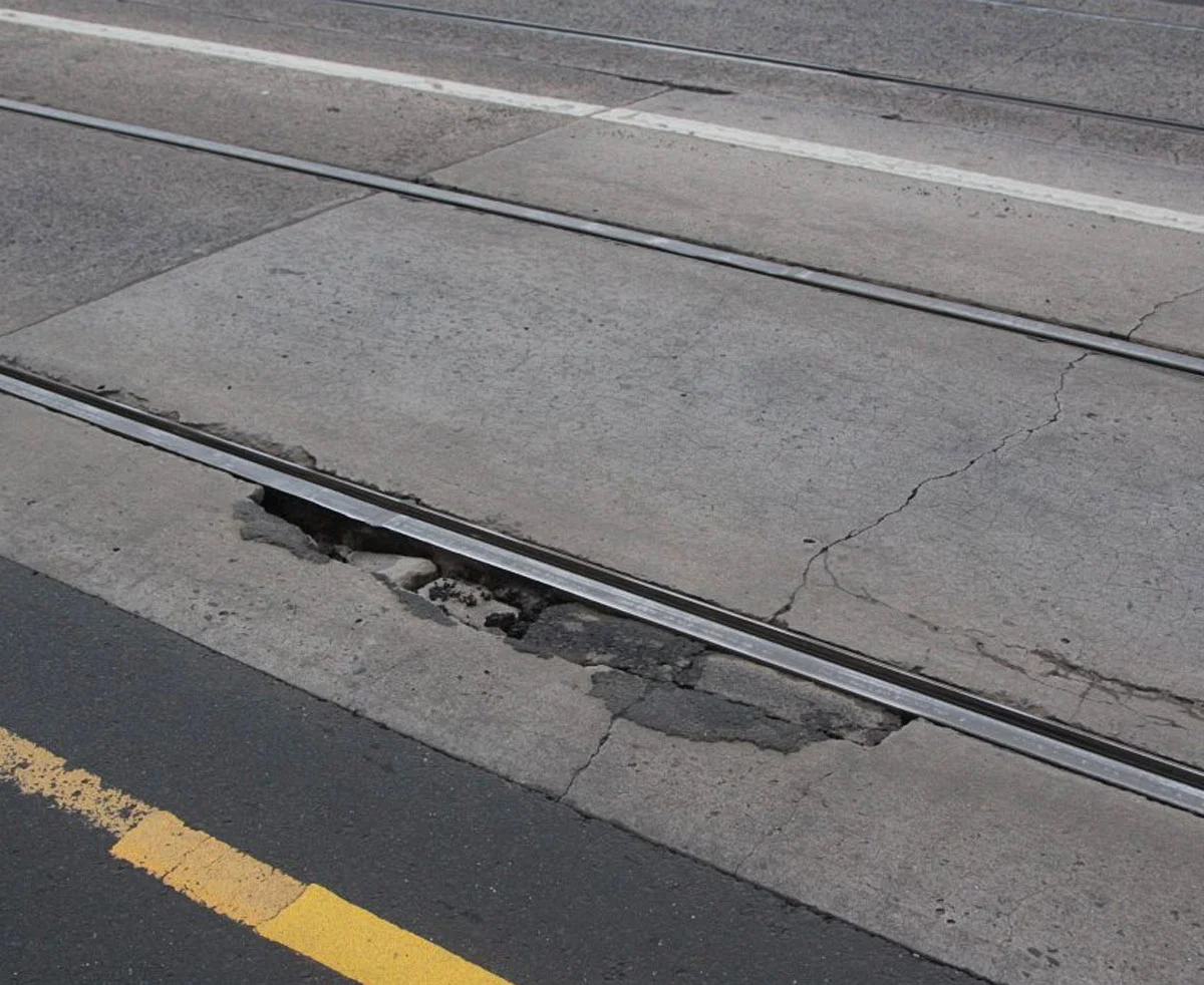 Tram tracks don't usually have surrounding damage like this