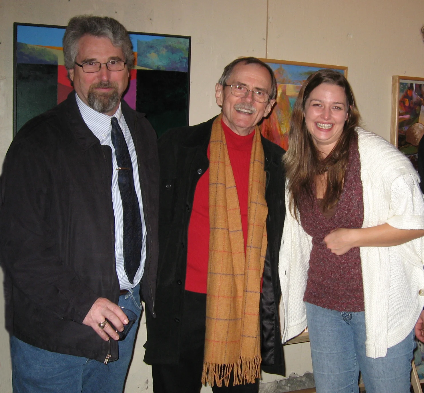 Larry J.Davis (center) with fellow Southlight Gallery artist Tony Wood (left) and Southlight Galerina Erin Walker (right) mark a year of growth and success culminating in the recent Patron's Party.