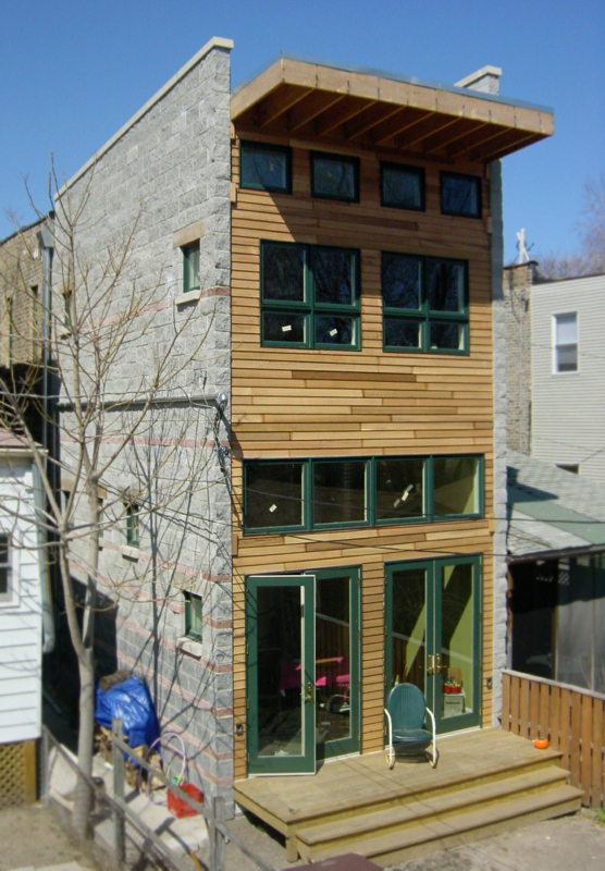 modern addition on 1890s single-family brick rowhouse, french doors
