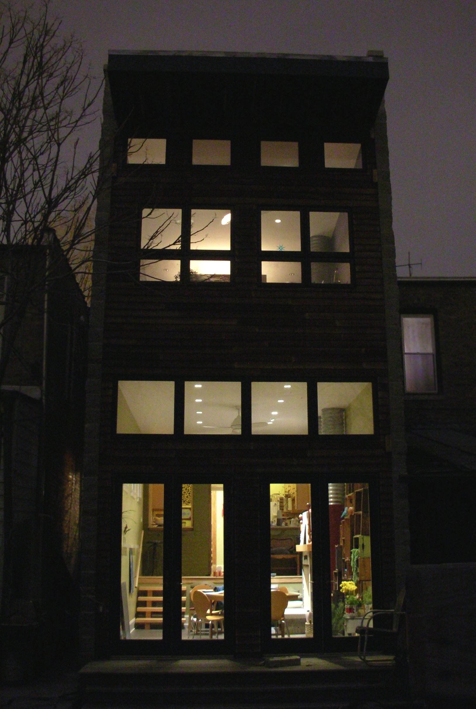 modern addition on 1890s single-family brick rowhouse, french doors, windows