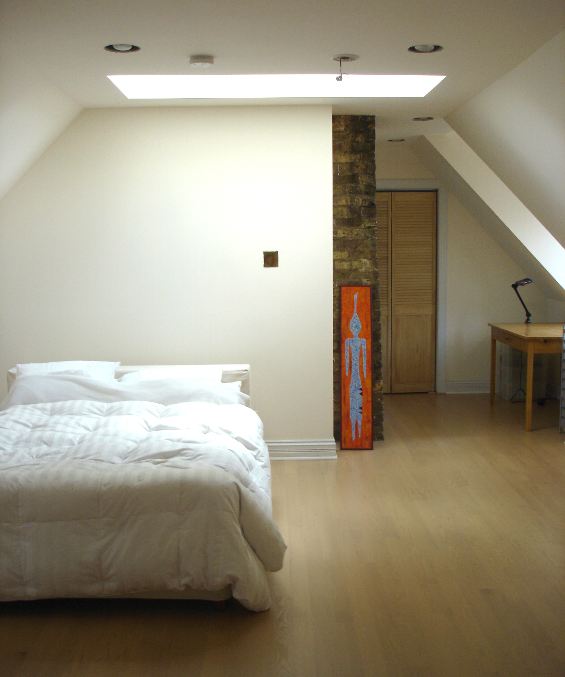 custom single-family residential home renovation, 1920s four-bedoom house, attic bedroom suite, skylight