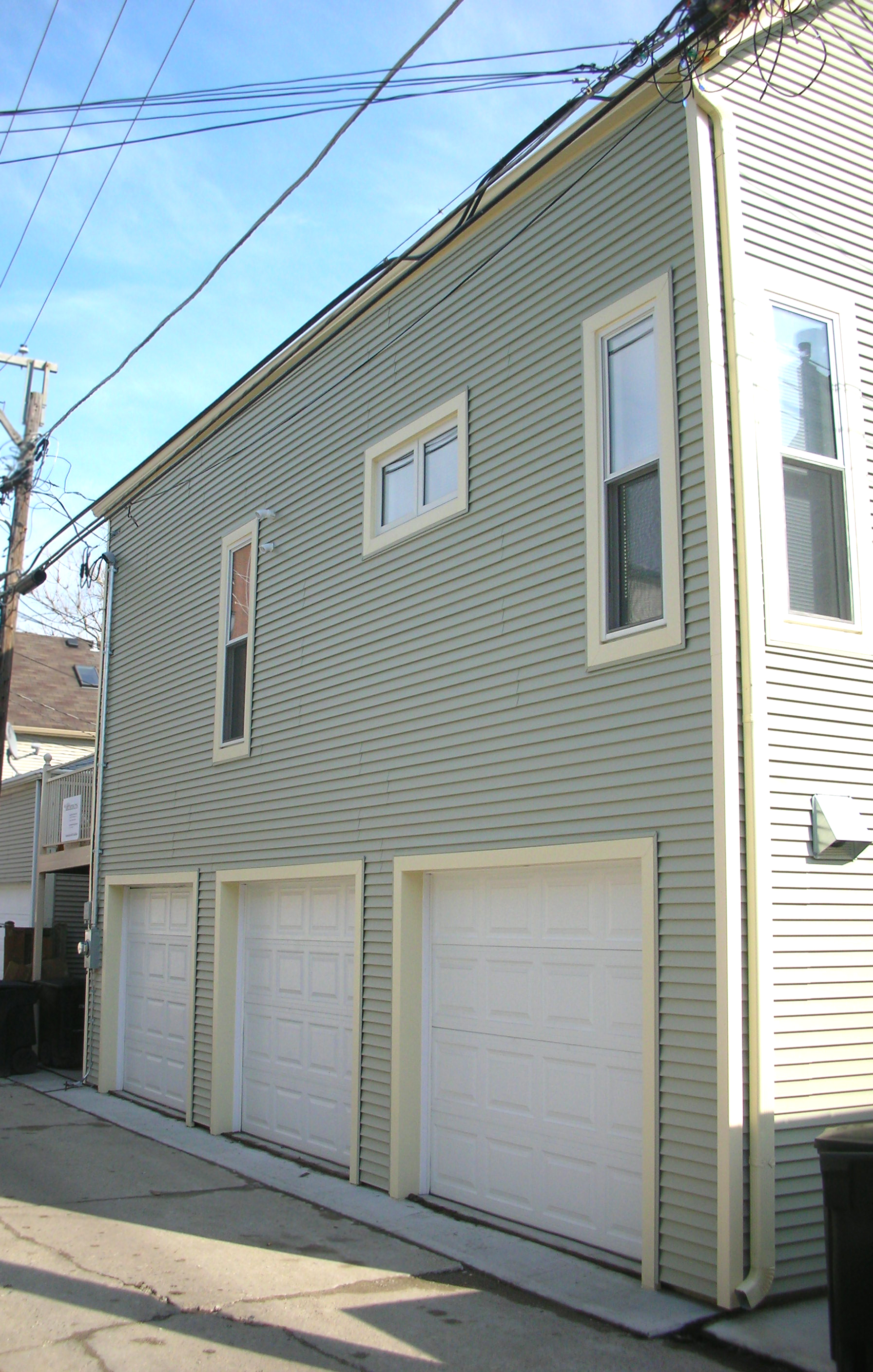 custom gut renovation single-family late-ninteenth-century coach house residential home, new deck, new ground-level parking, 3-car garage