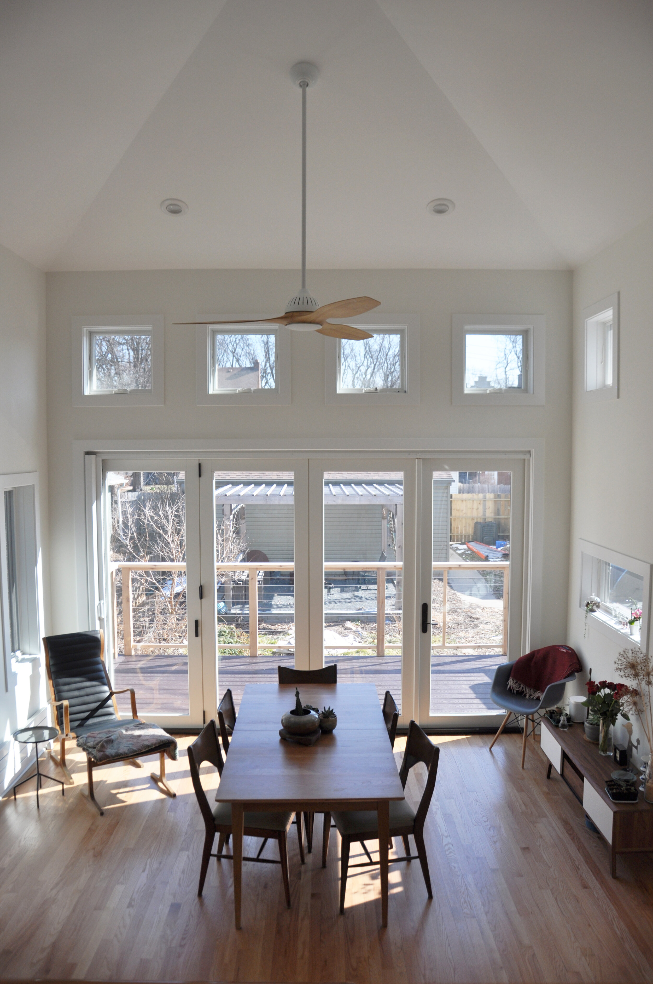 living space with tall ceilings, french doors, many windows