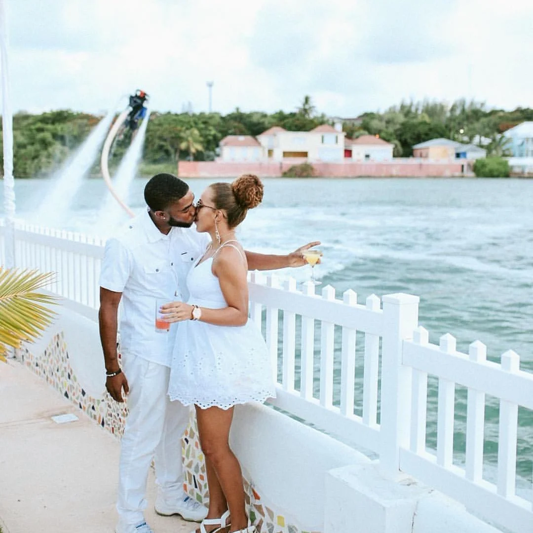 evolve fitness trainer Charles sealey and girlfriend pose at white party bahamas. a summer event organized by jetlink adventures and Bahari bahamas . 