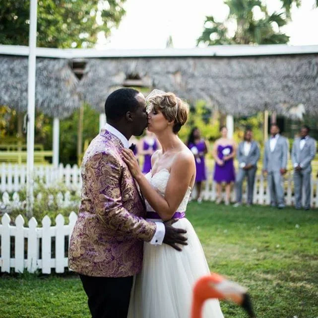 Hot 91.7fm on-air personality jay isaacs and wife wed in the flamingo at the ardastra gardens, zoo and conservation centre.