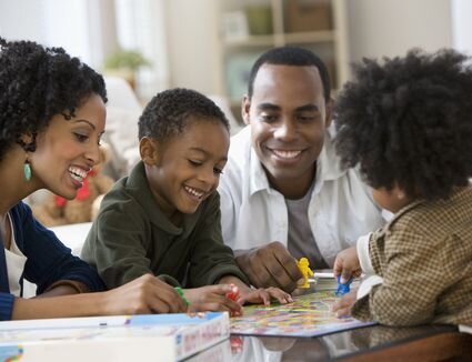 african-american-family-playing-board-game-together-135538056-e4b4006222b1449ba823dd79d4224138.jpg
