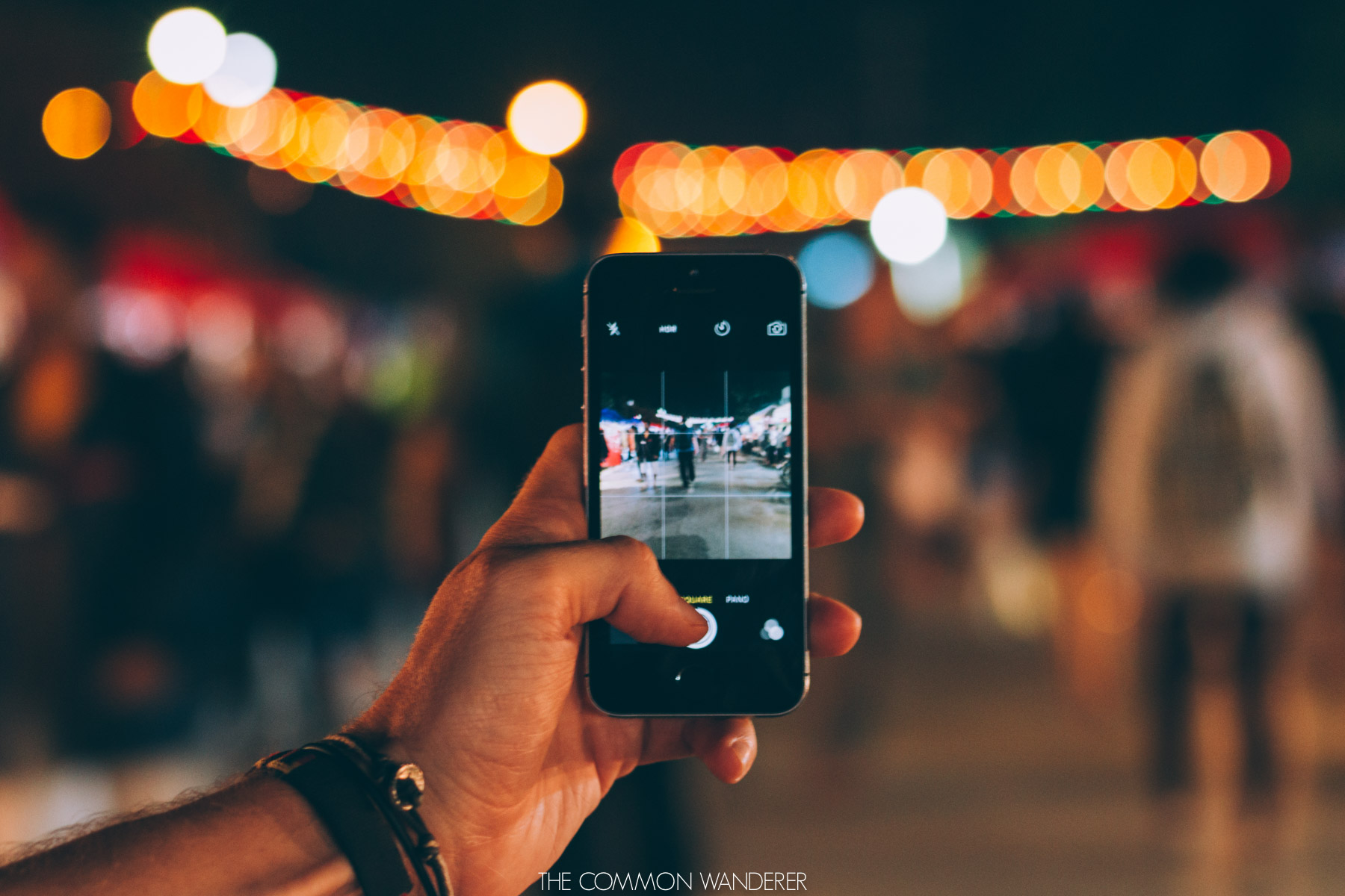 a man walking through the Luang Prabang night market