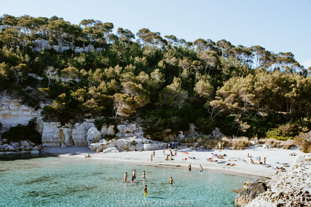 The beach of Cala Mitjana on Menorca, Spain - The Common Wanderer