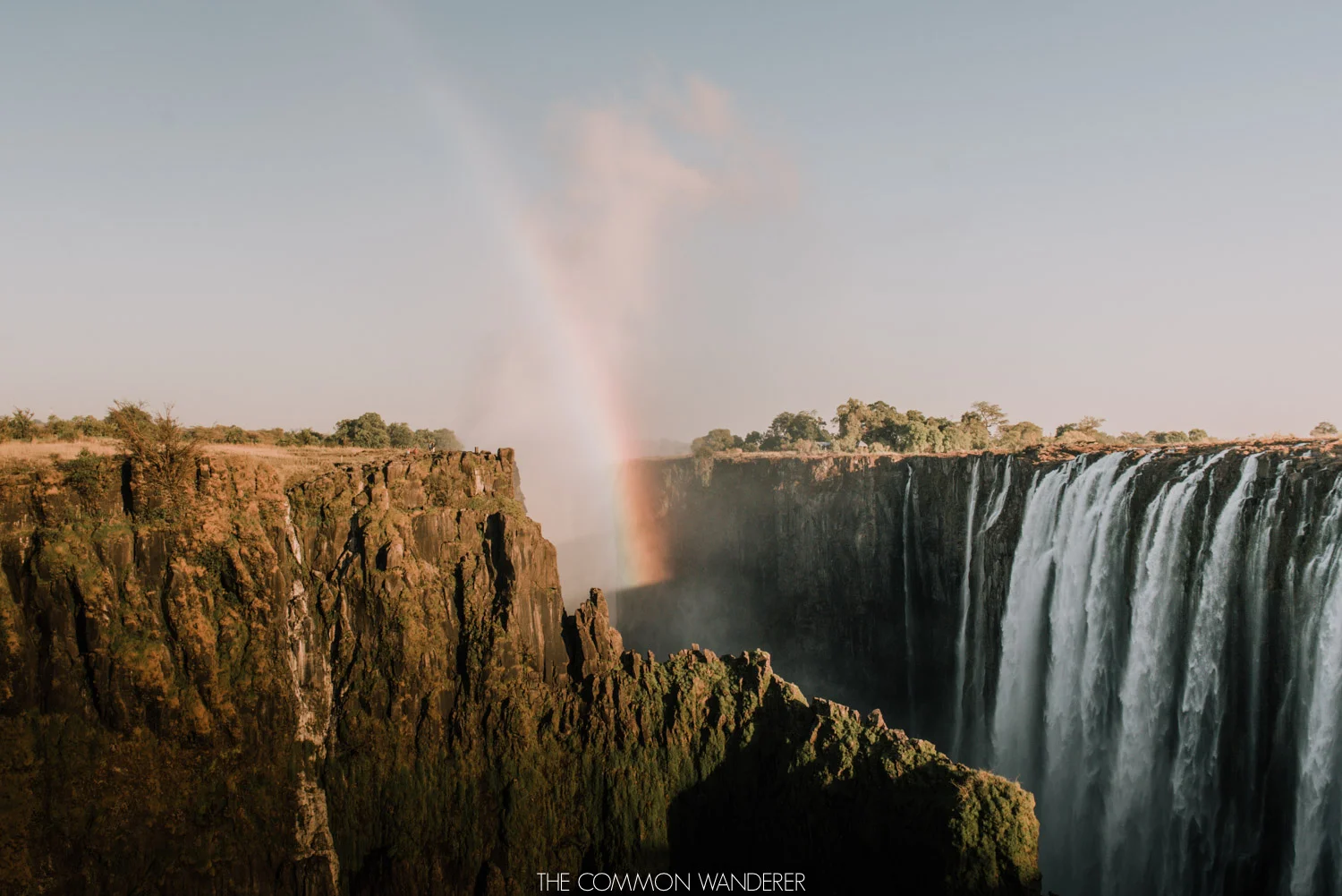 A rainbow over Victoria Falls, Zambia - The Common Wanderer