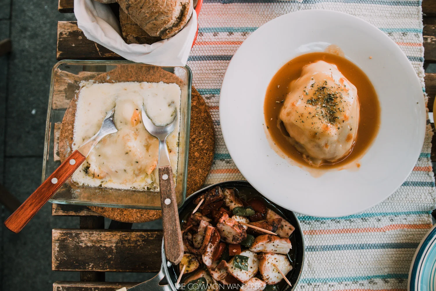 Local food in Porto - Francesinha, grilled octopus, and fresh bread