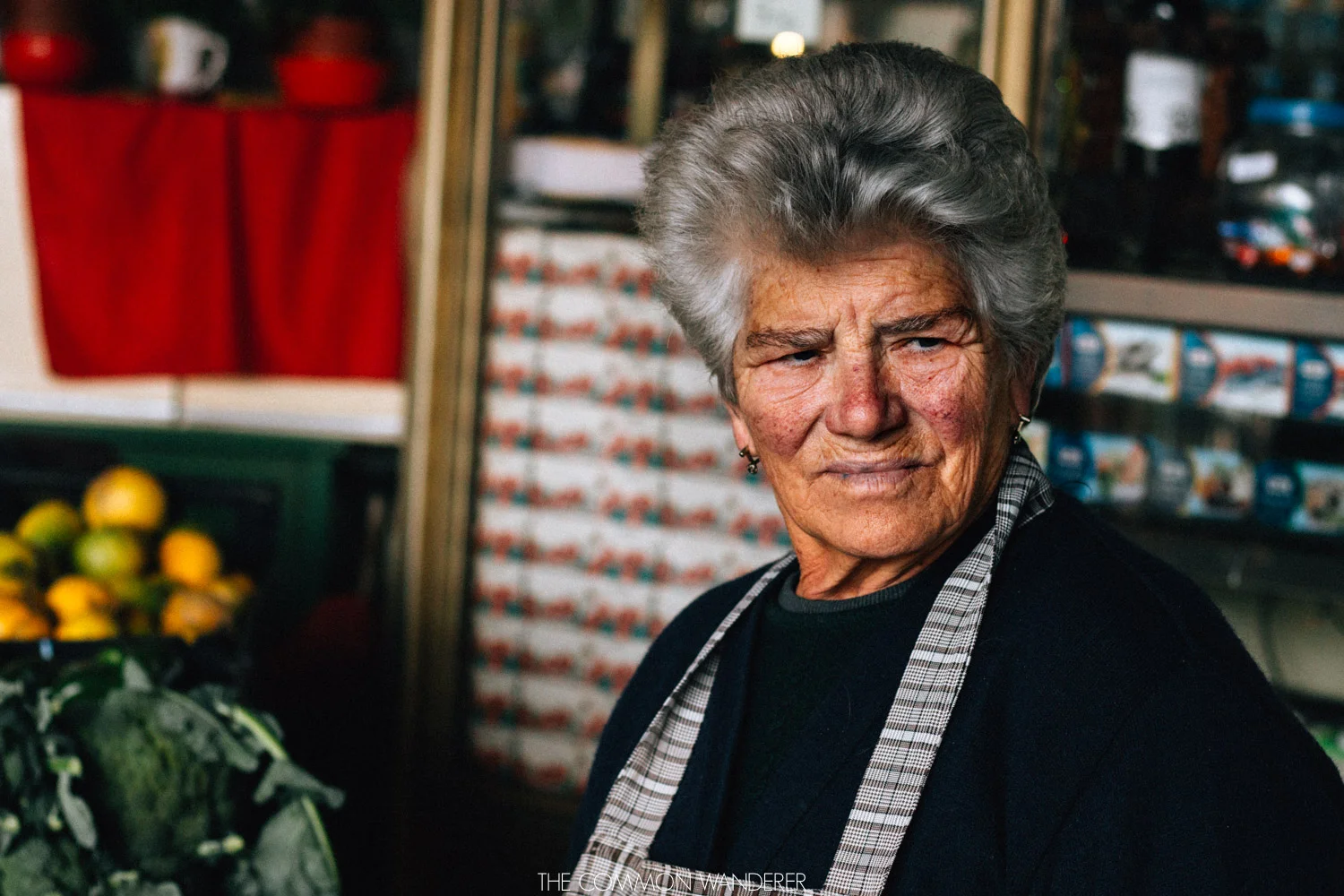 a lady smiles at her customers in the Mercado do Bolhao in Porto 