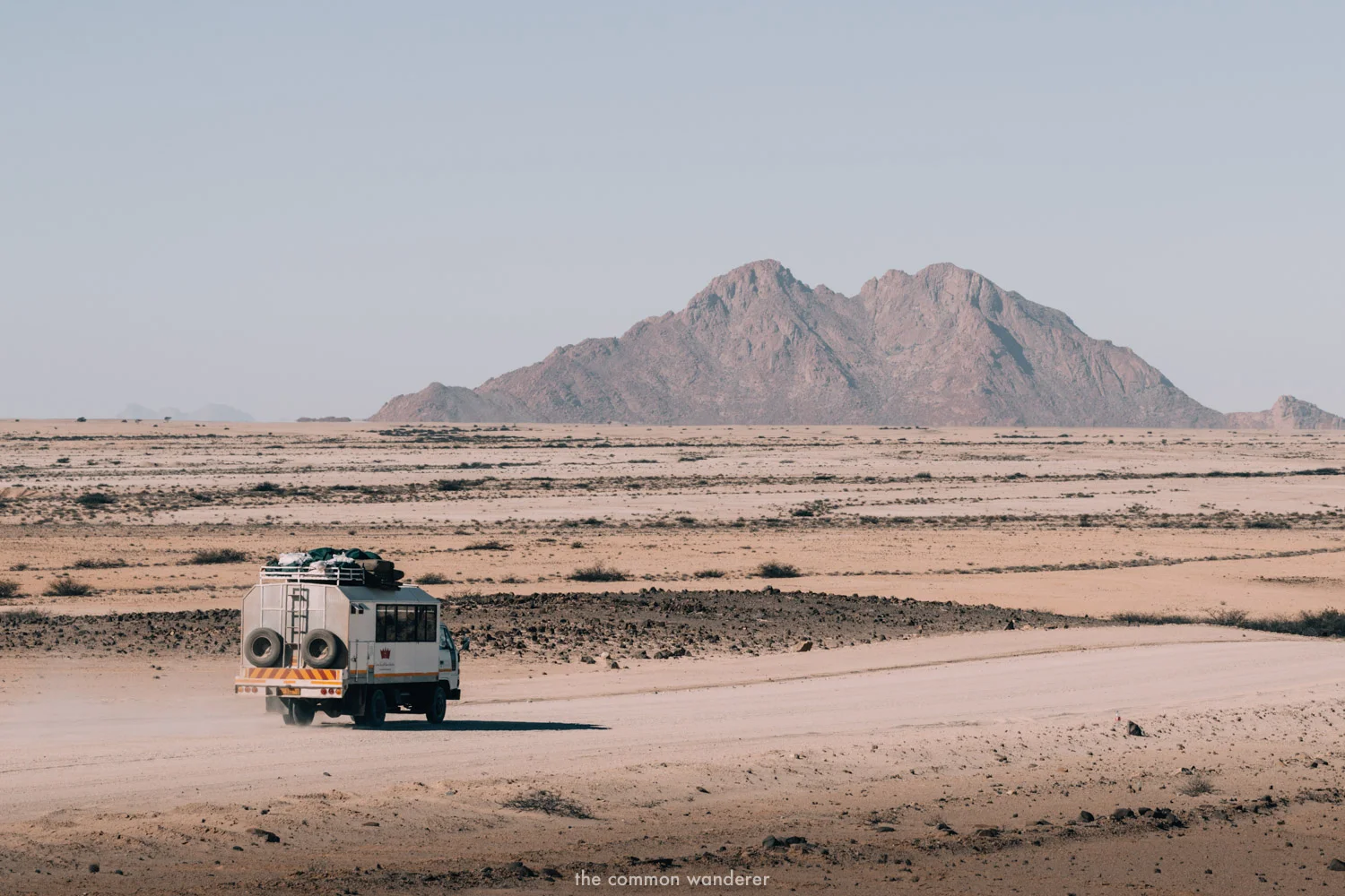 An overland bus travels through Namibia - overland can be a safe way to travel Africa