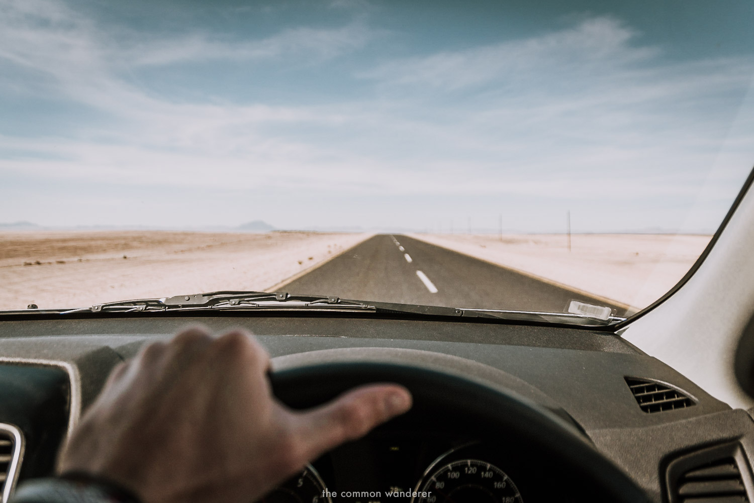 Driving along a long, straight road in Namibia - Namibia photos