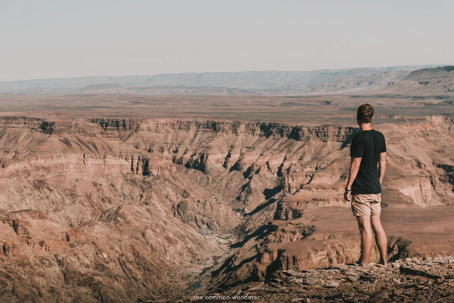 A man overlooks Fish River canyon in Namibia