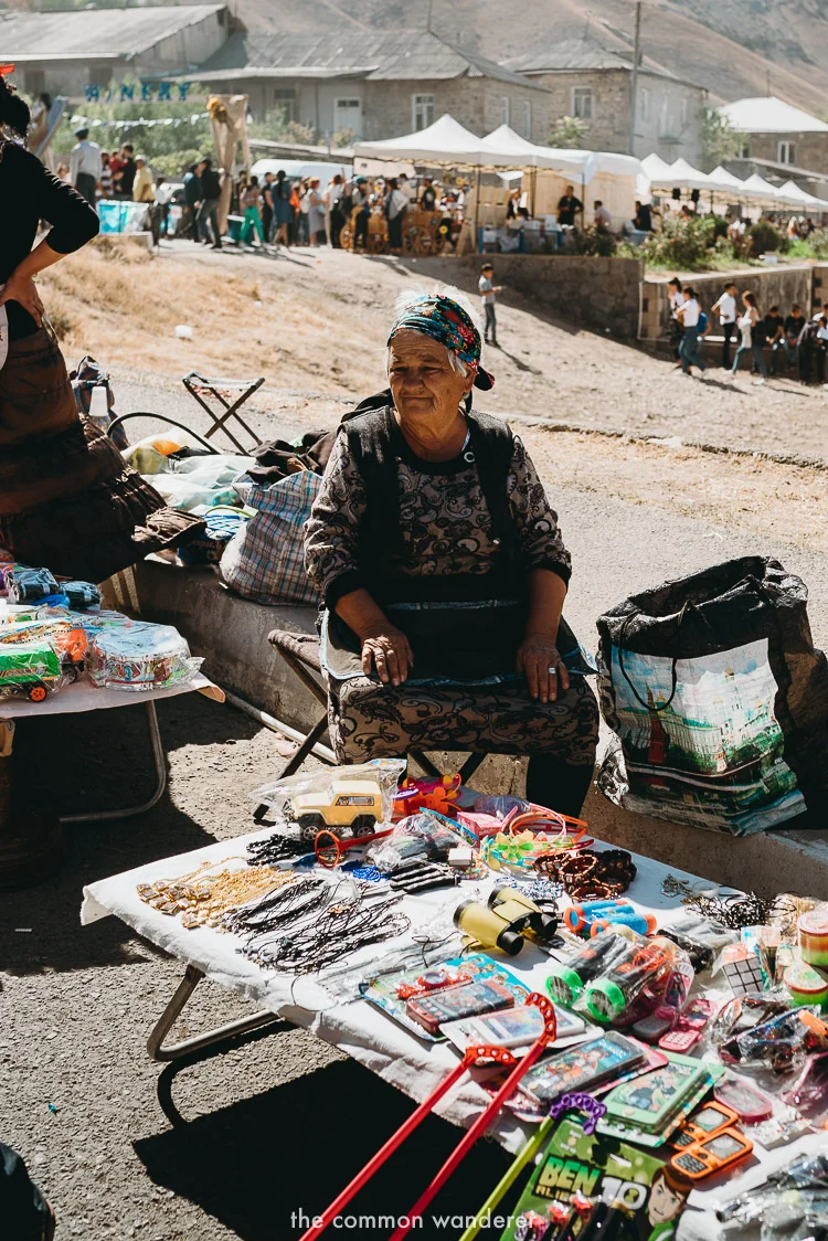 A woman selling wares at a market in Areni, Armenia