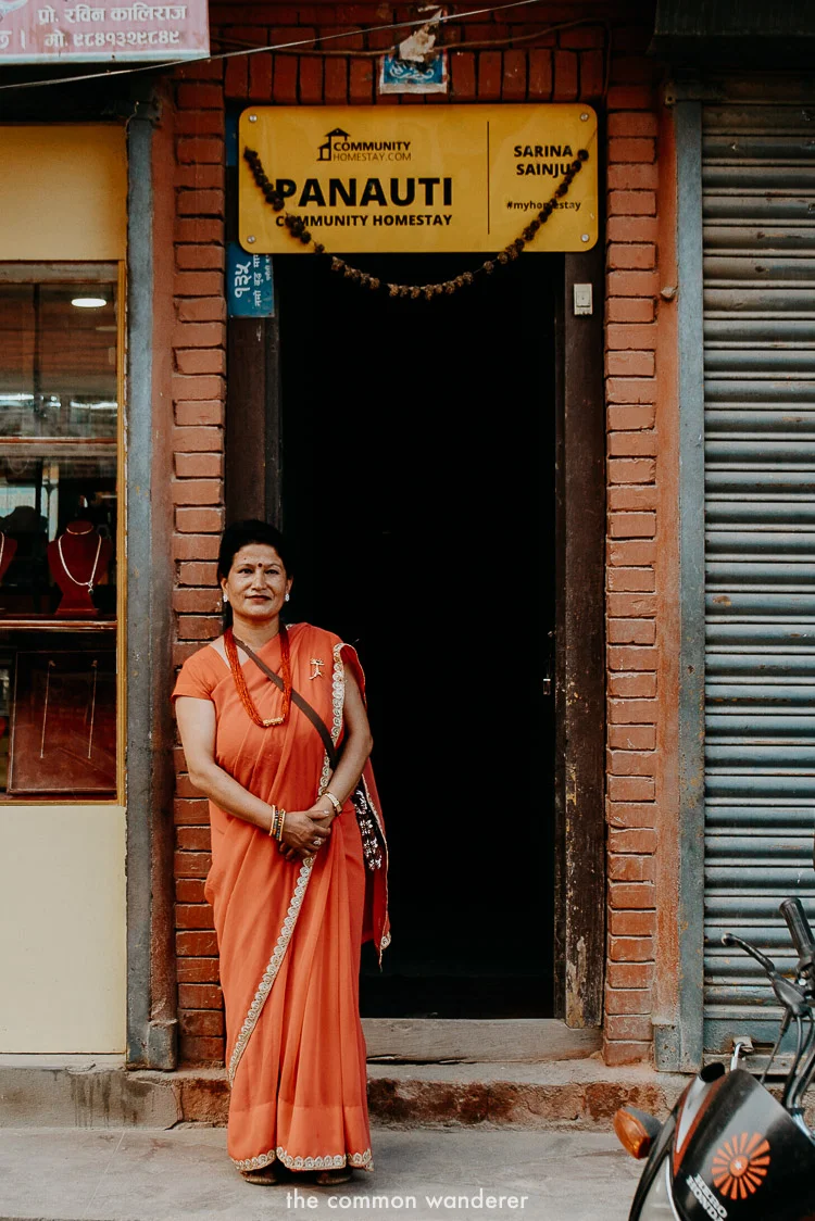 Sarina, our Panauti Homestay host stands in front of her front door