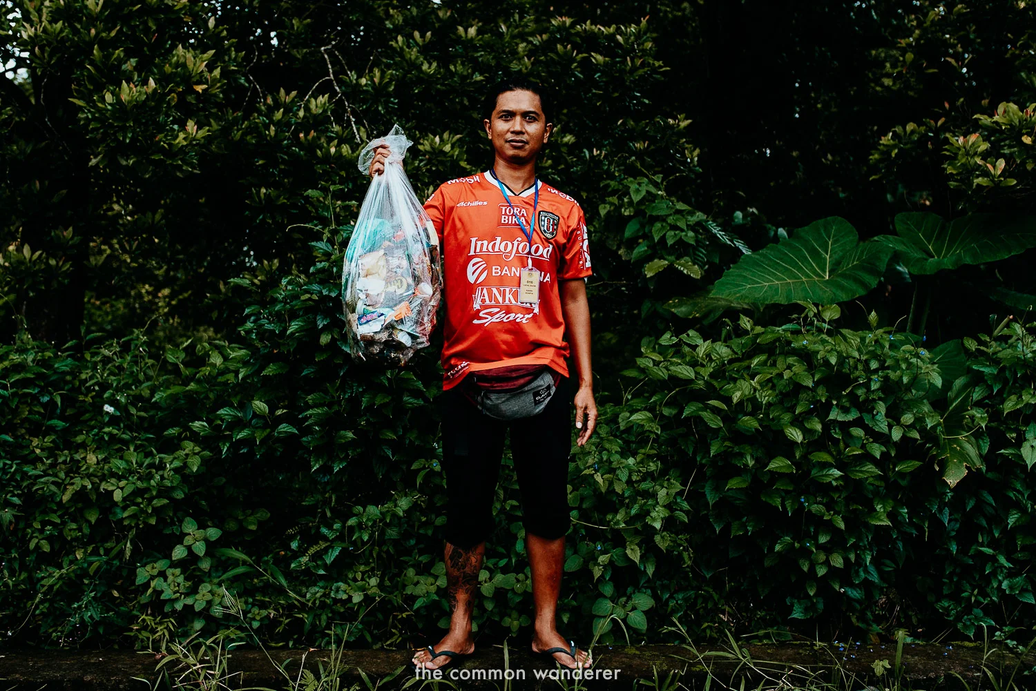 Our guide, Kadek, with a bag of rubbish we picked up in Sekumpul Waterfall, Bali
