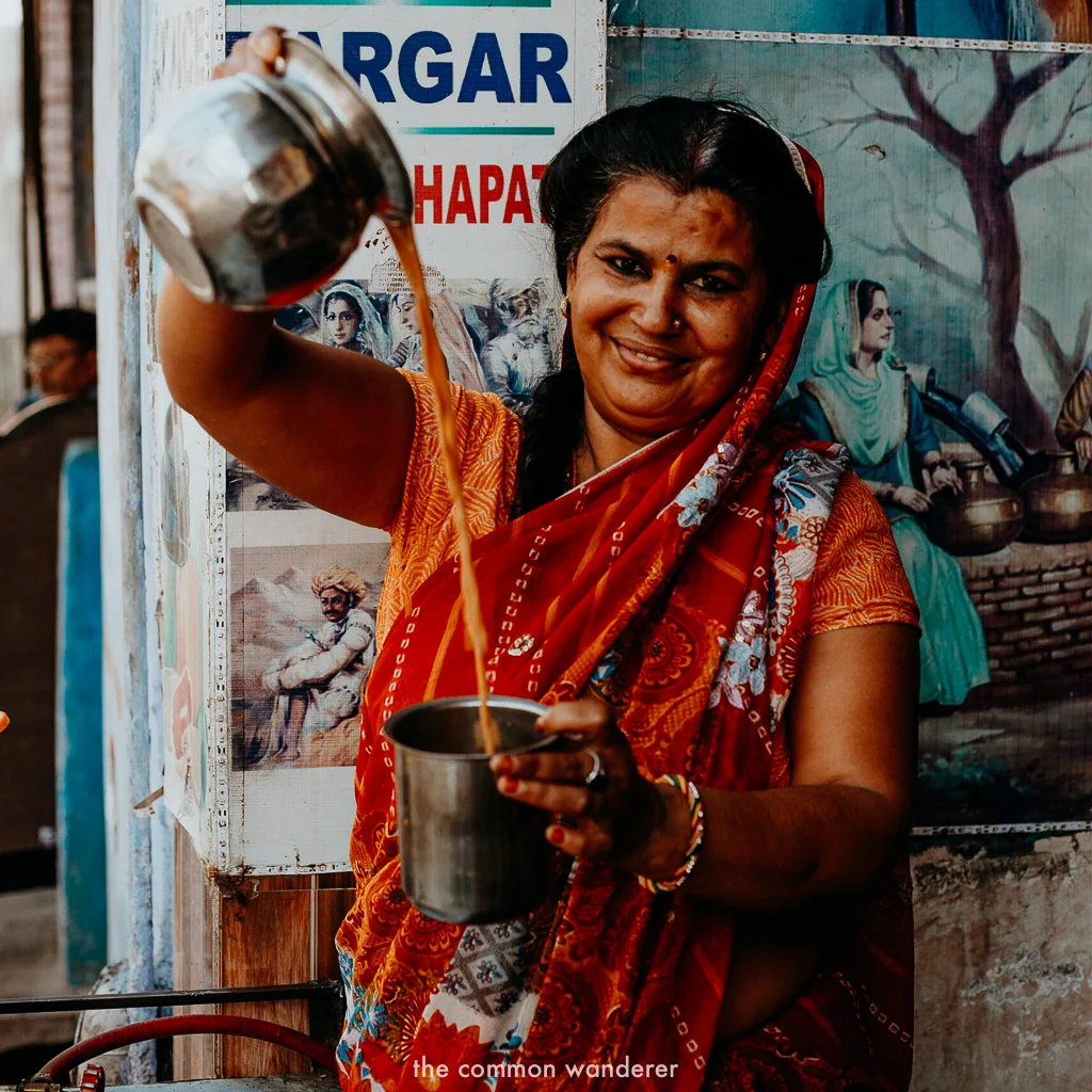 Sunita pours chai into a cup in Bundi