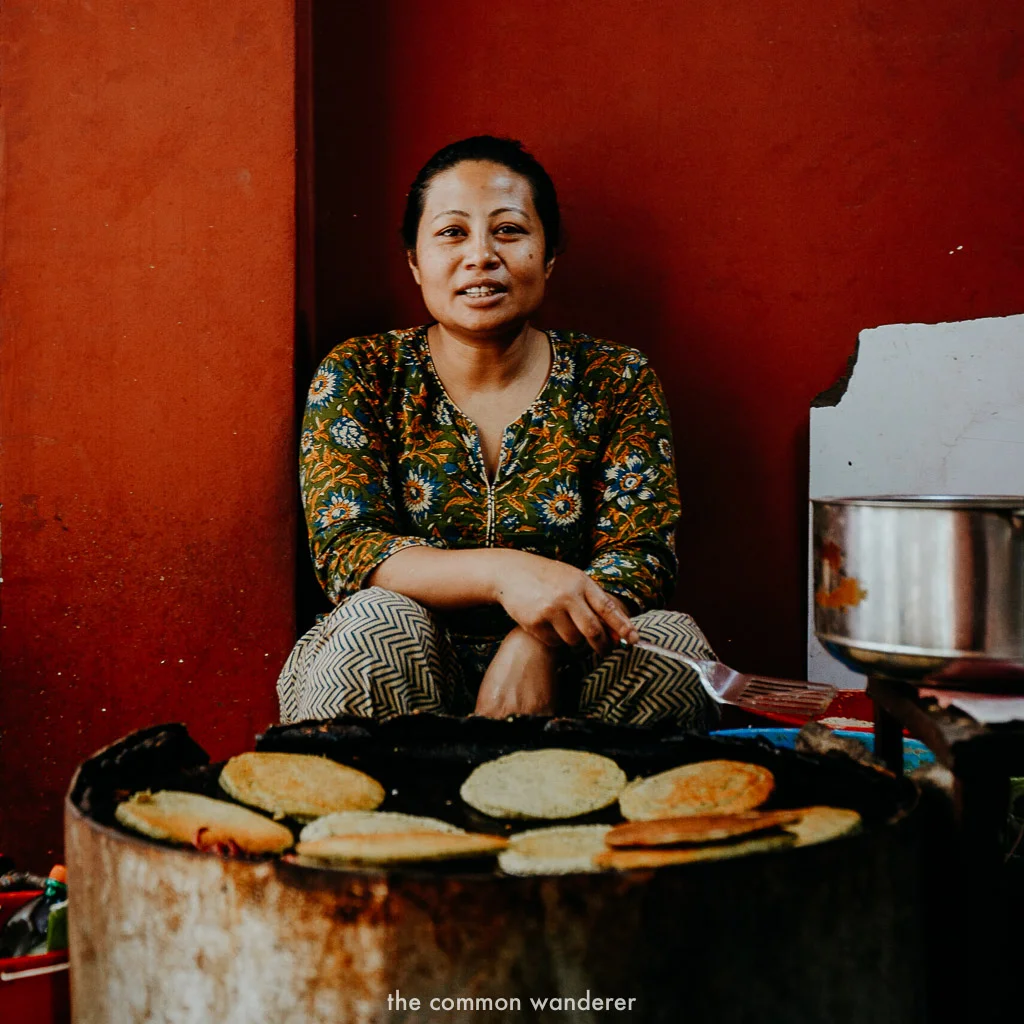 A lady make fresh lentil pancakes in Kathmandu, Nepal