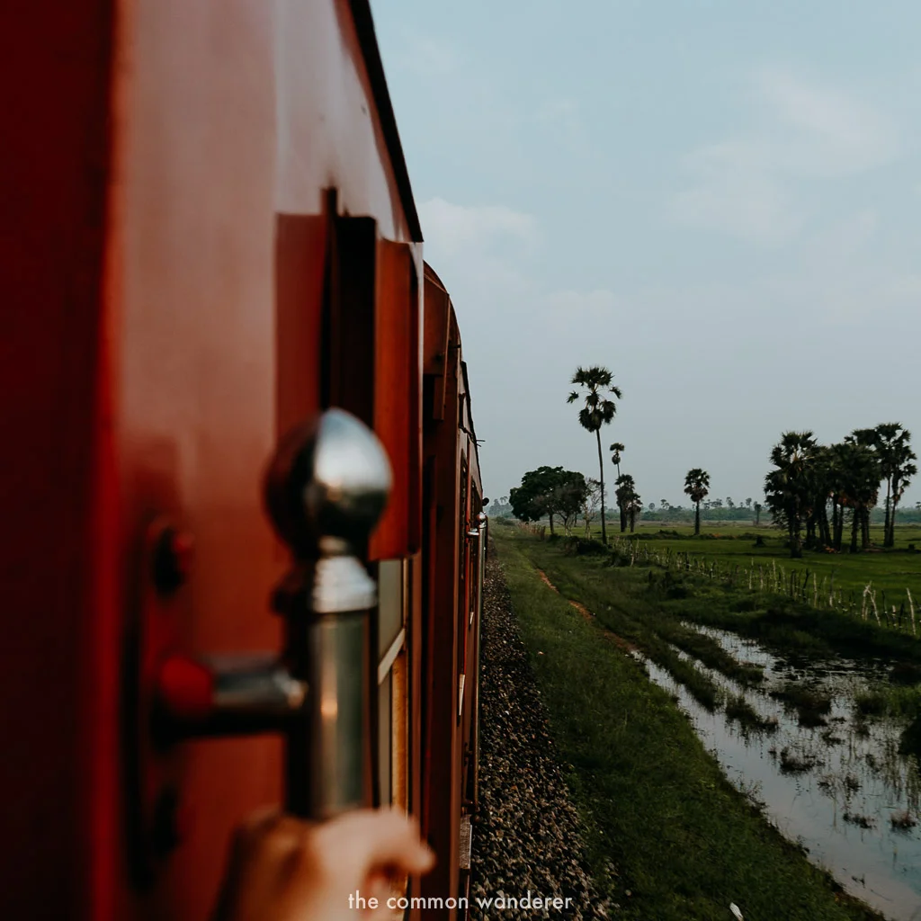 Hanging out the train from Jaffna to Colombo, Sri Lanka