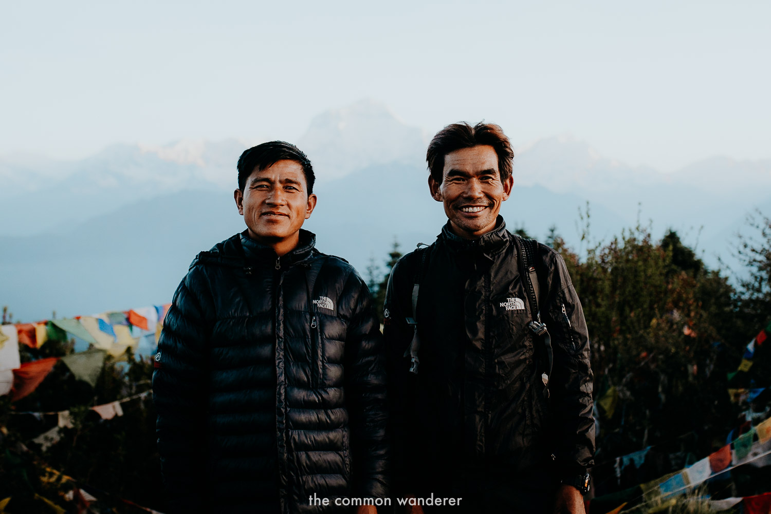 Poon Hill guide and porter on the summit of Poon Hill, Nepal