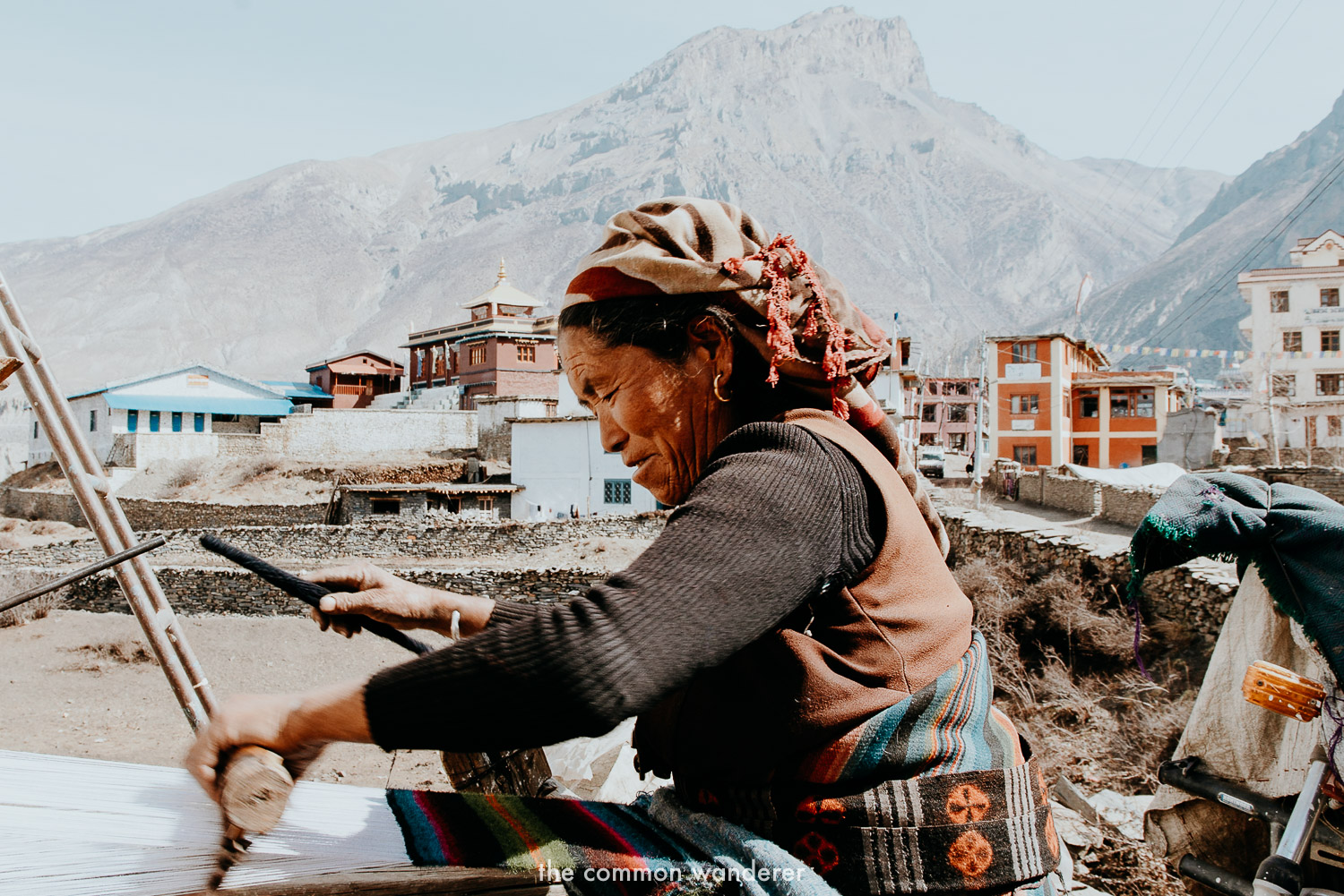 A local women makes a traditional scarf in Muktinath, Annapurna Circuit Nepal